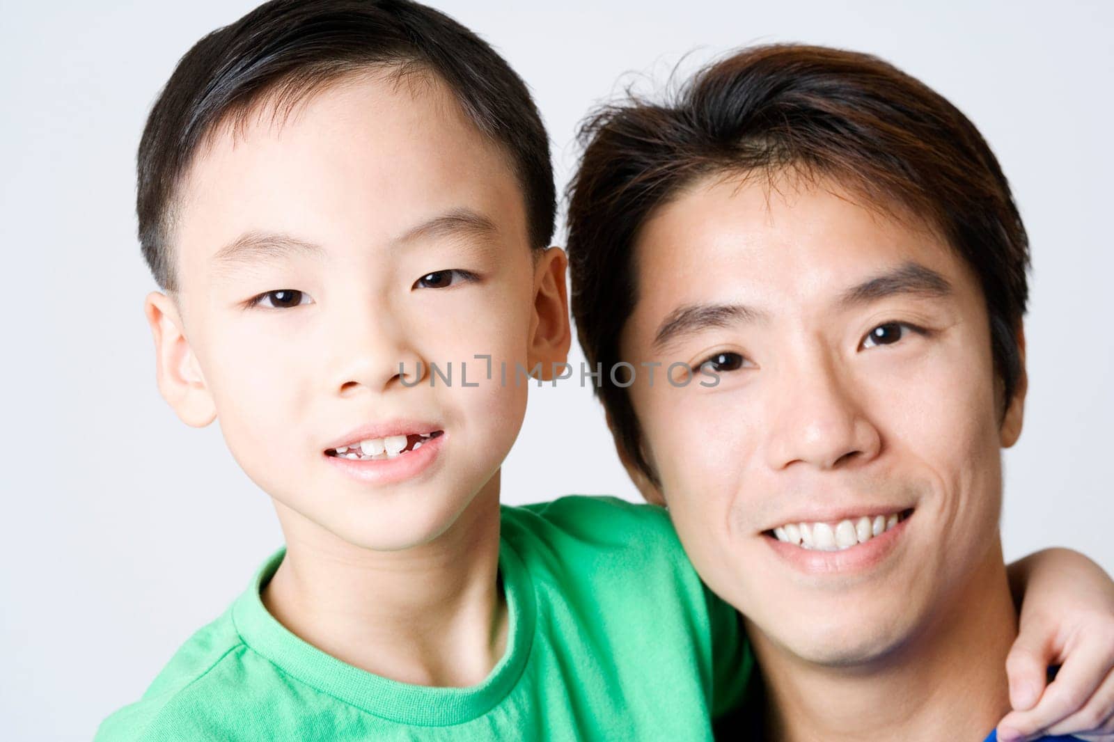 Portrait of a mid adult man smiling with his son