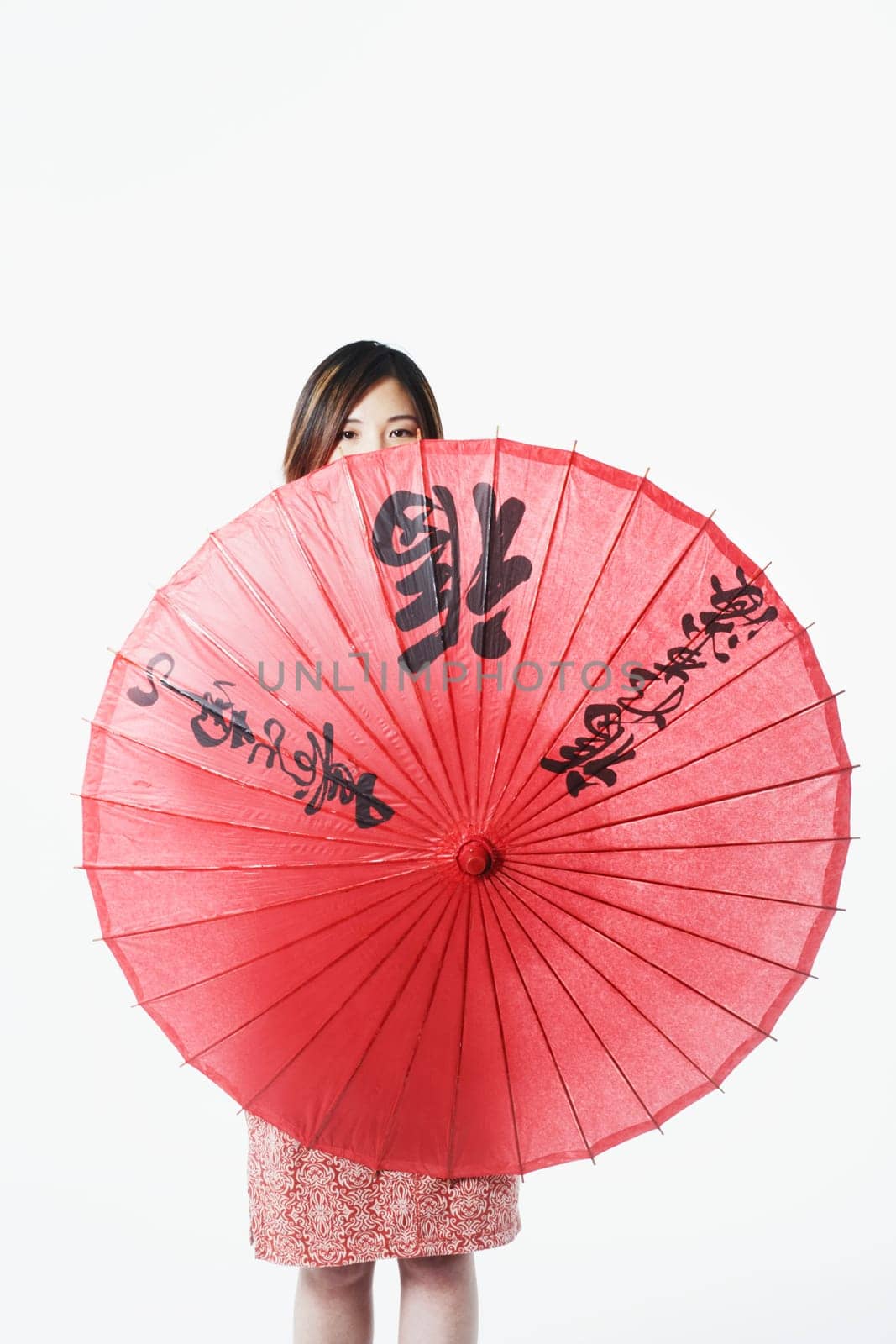Portrait of a mid adult woman holding a parasol
