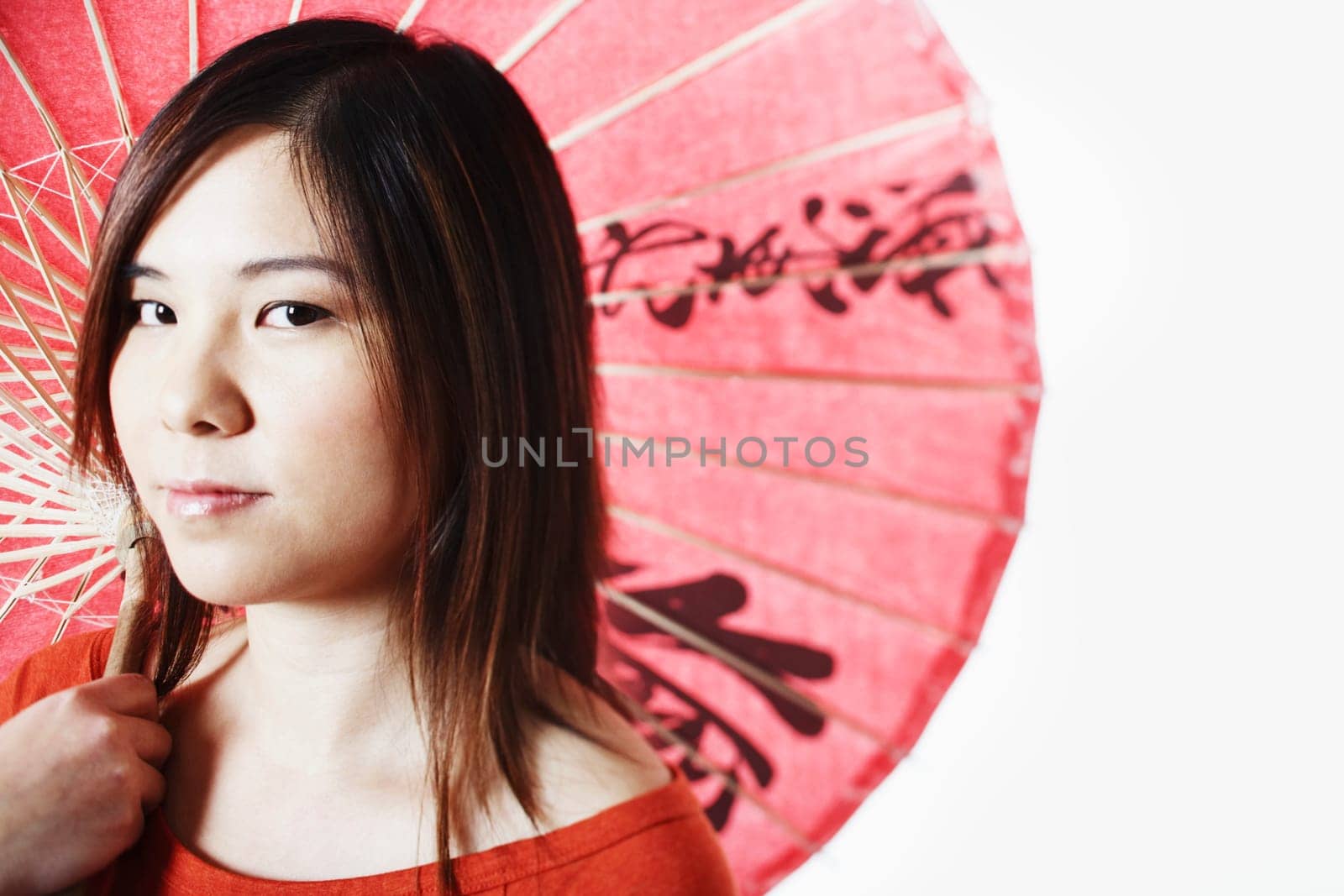 Portrait of a mid adult woman holding a parasol