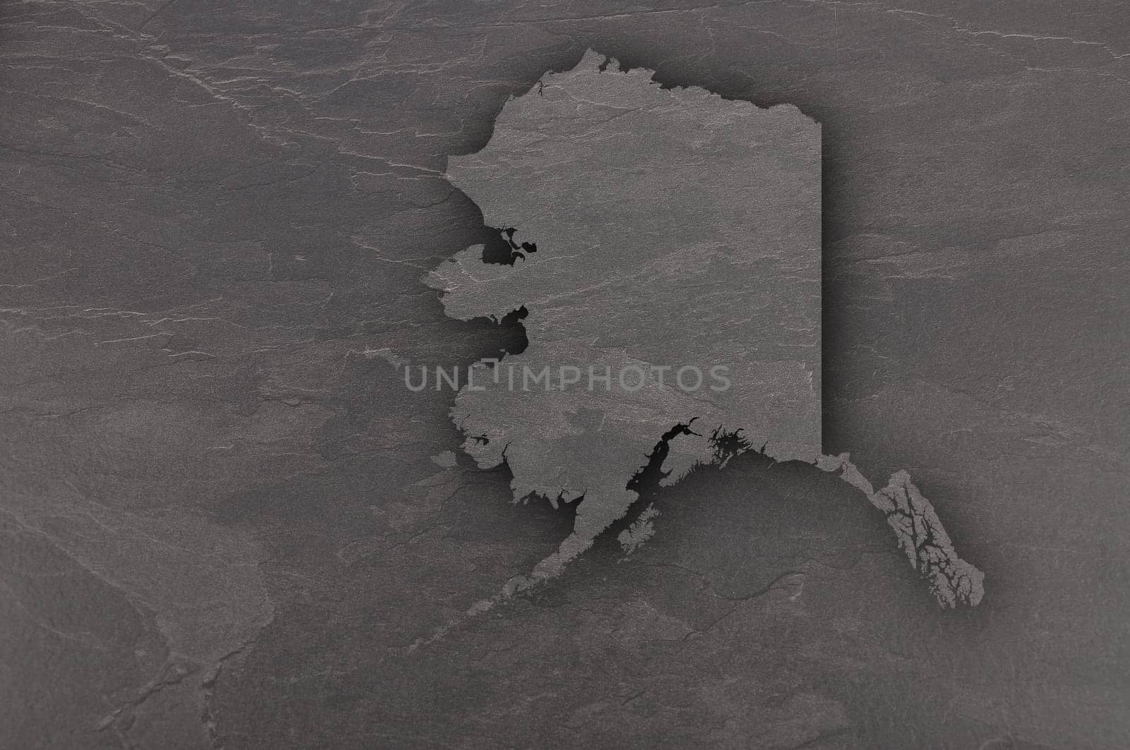 Map of Alaska on dark slate