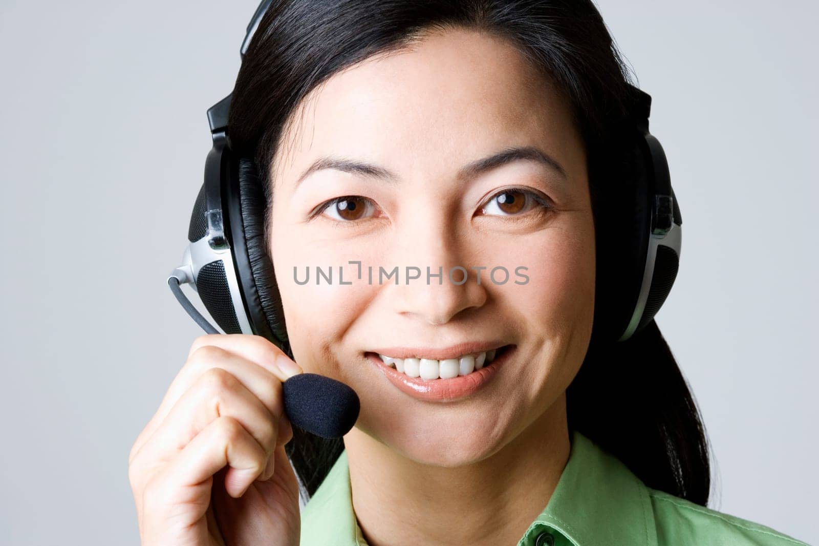 Portrait of a businesswoman using a headset and smiling