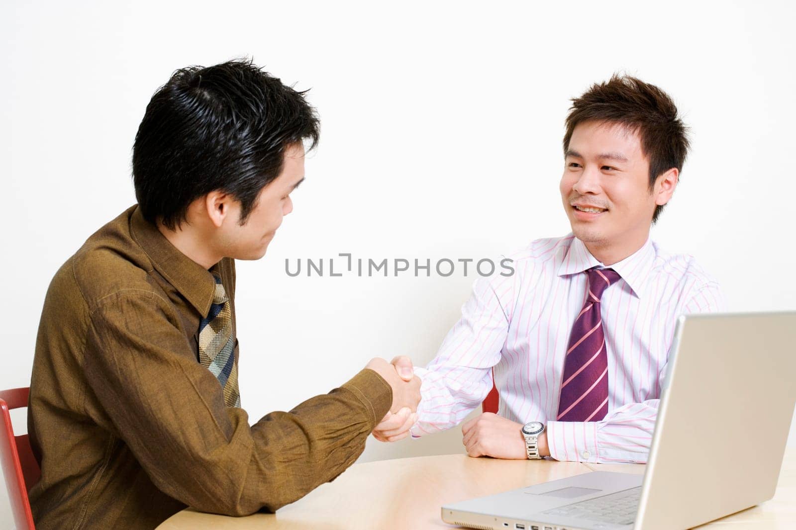 Two businessmen shaking hands