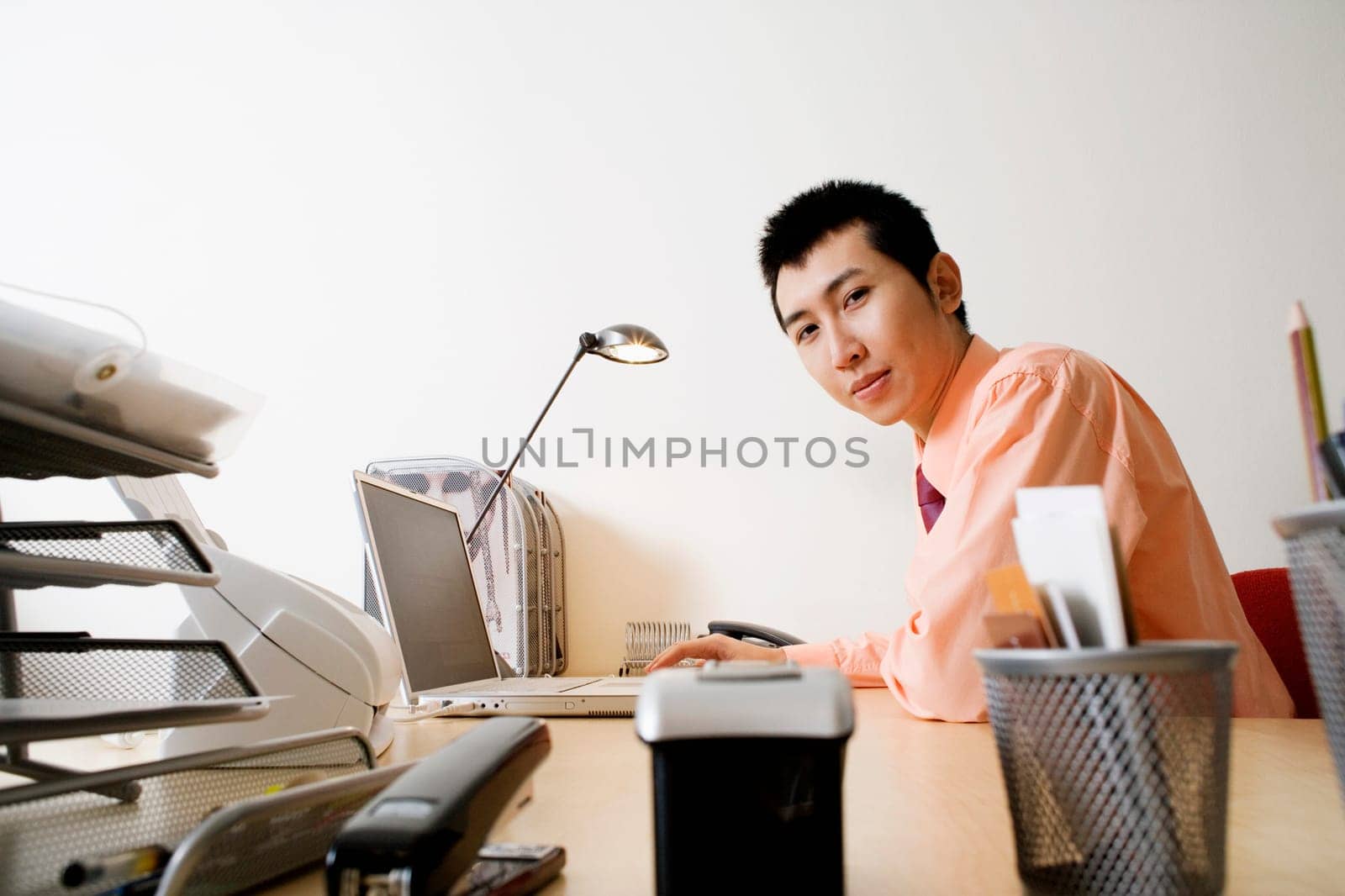 Portrait of a businessman using a laptop