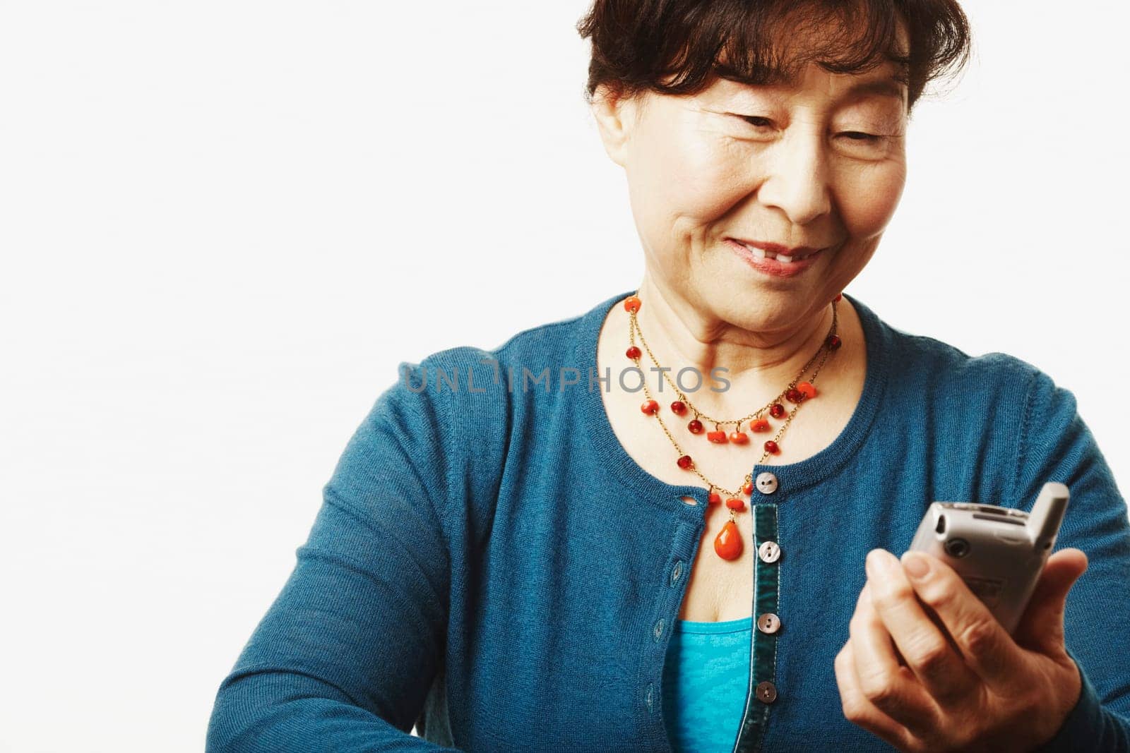 Close-up of a mature woman looking at a mobile phone