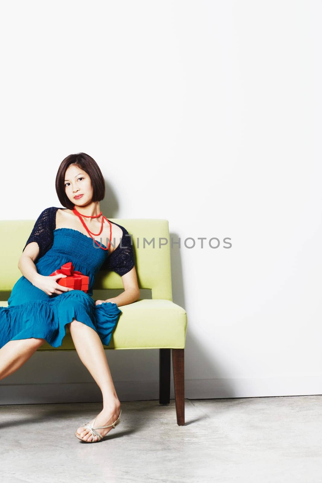 Portrait of a young woman holding a gift