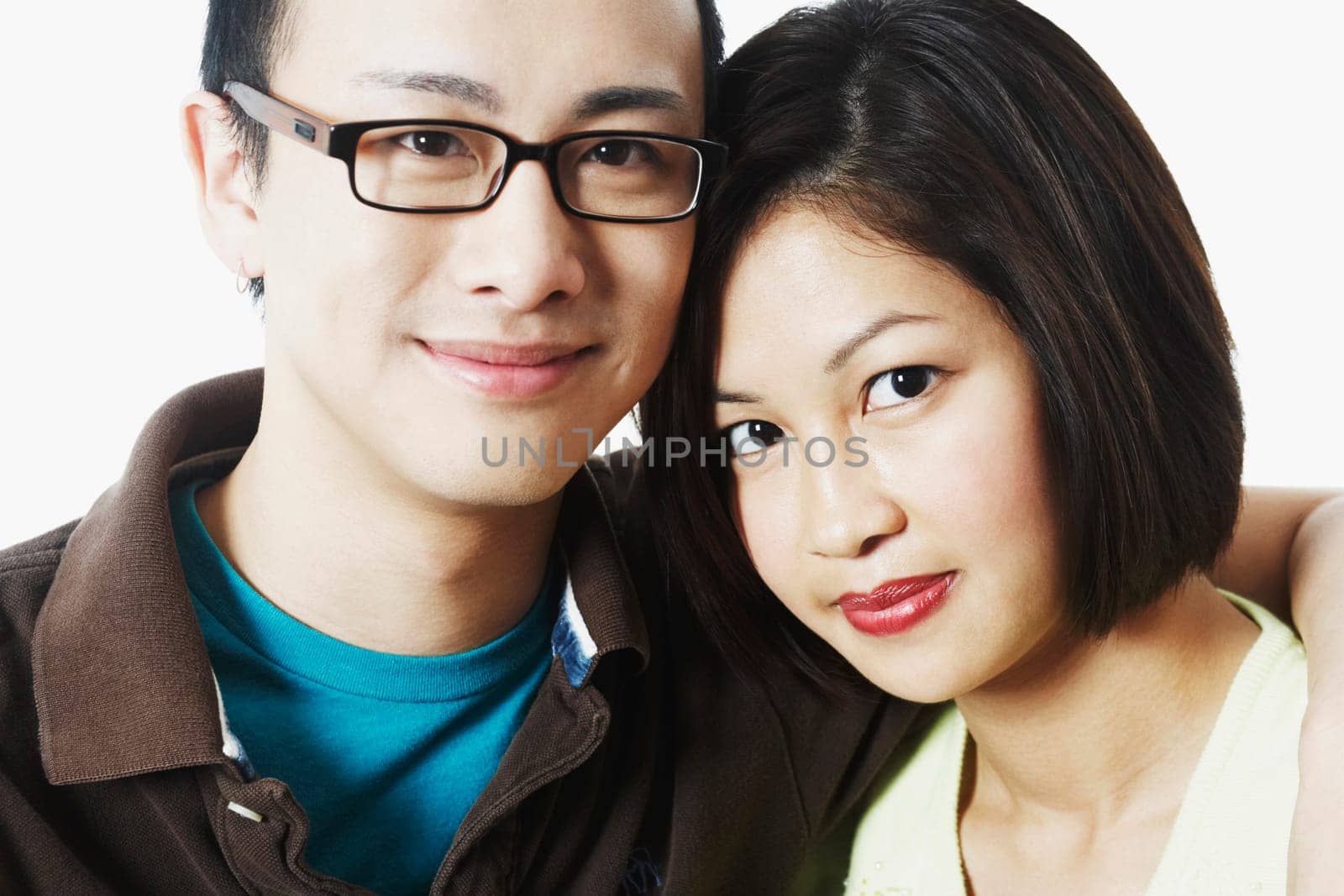 Portrait of a young man embracing a young woman