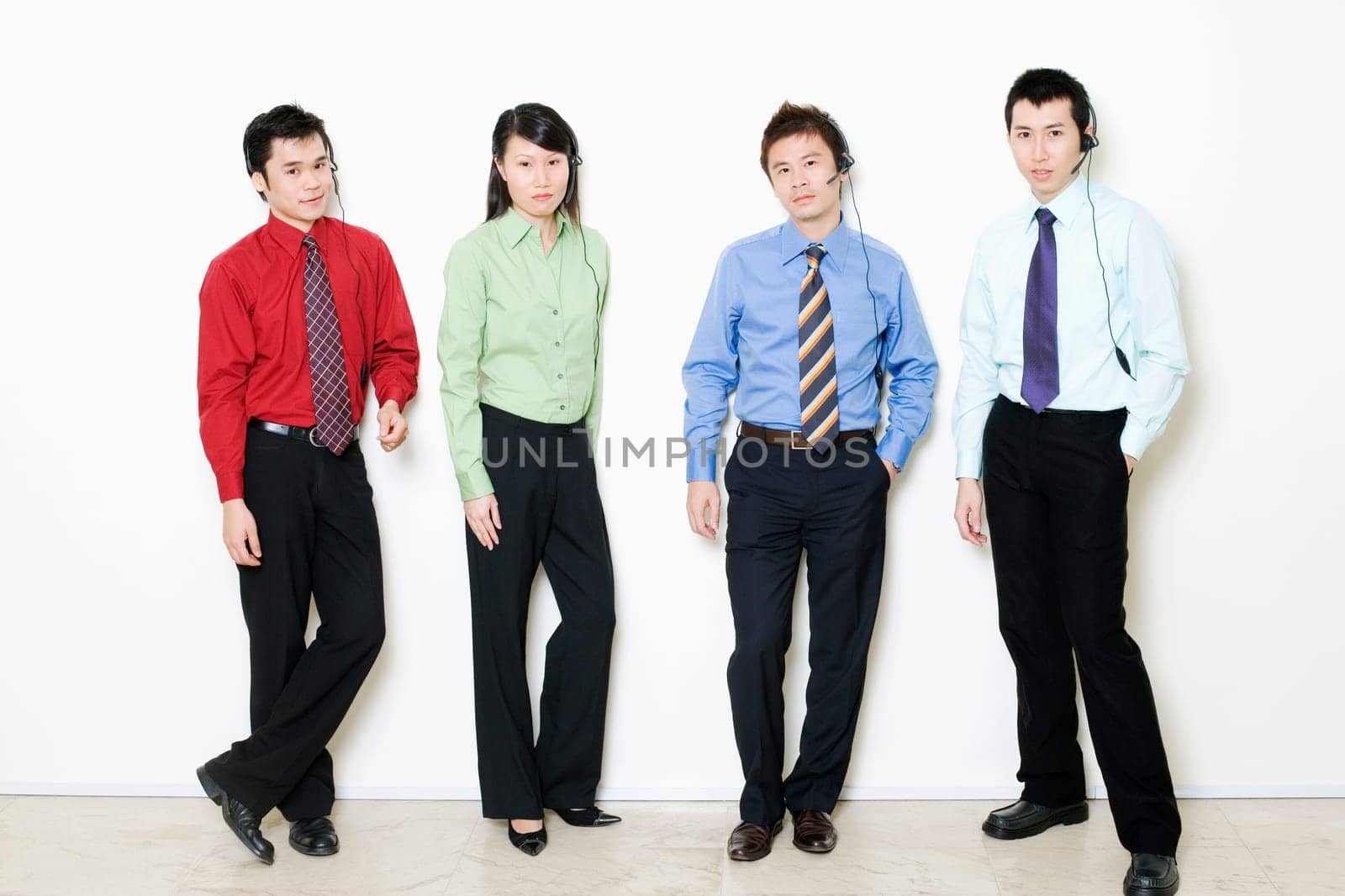Portrait of four customer service representative standing together
