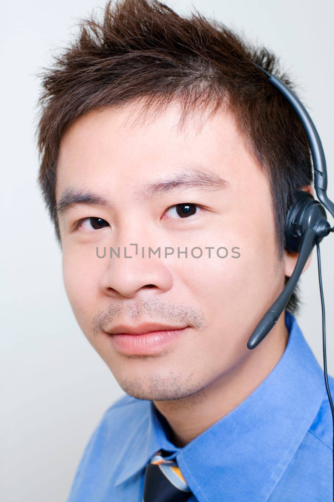 Portrait of a male customer service representative using a headset