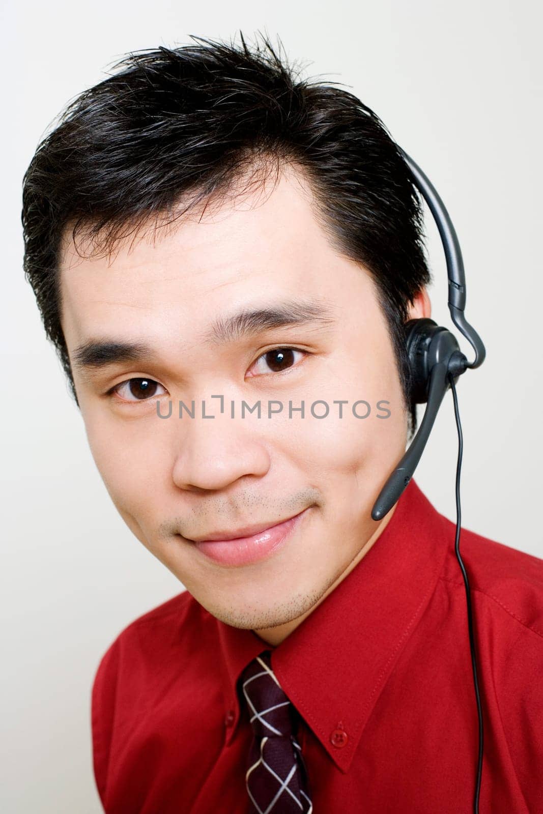 Portrait of a male customer service representative using a headset