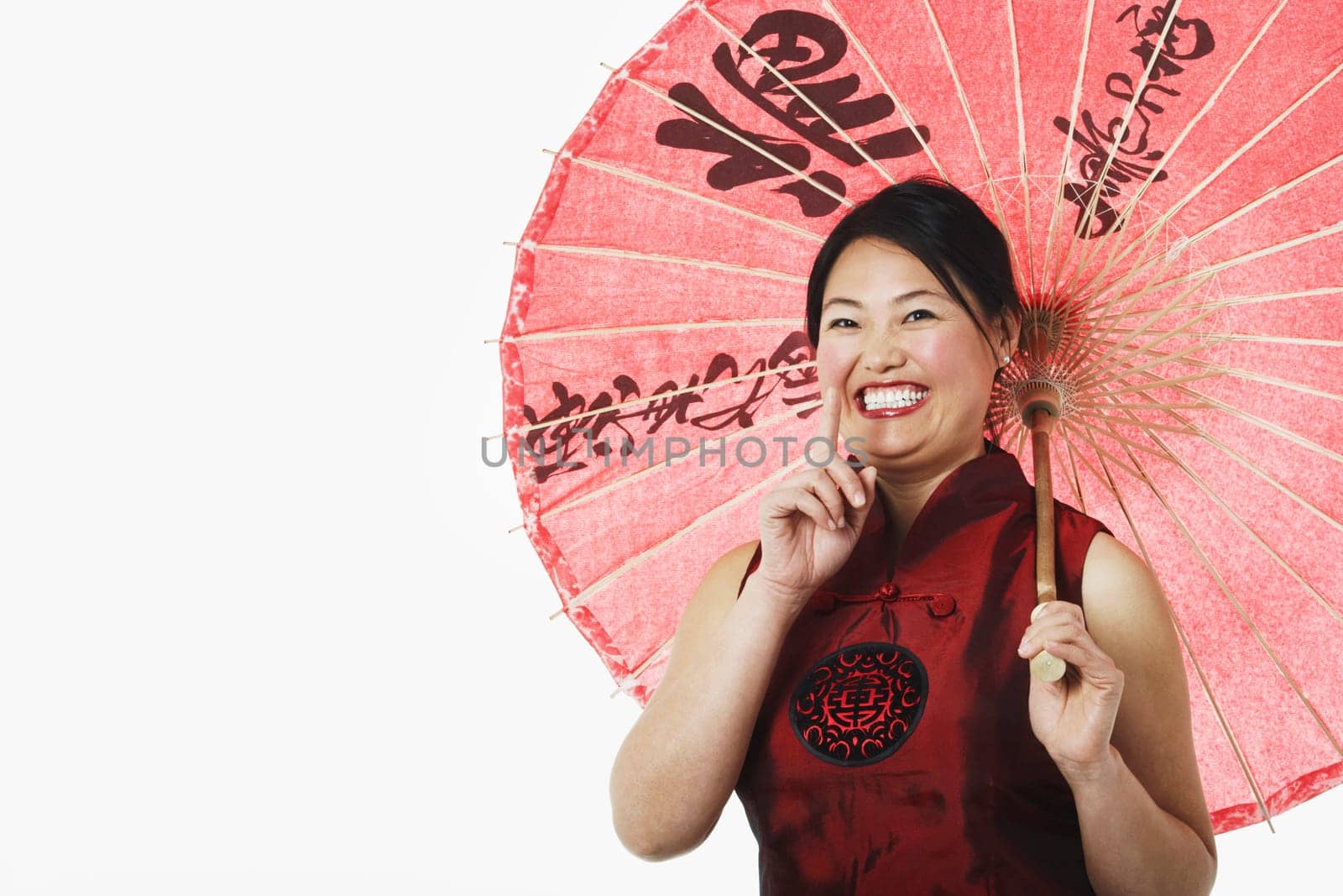 Portrait of a mid adult woman holding a parasol