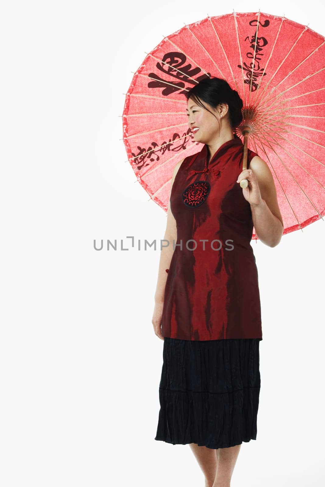 Mid adult woman holding a parasol