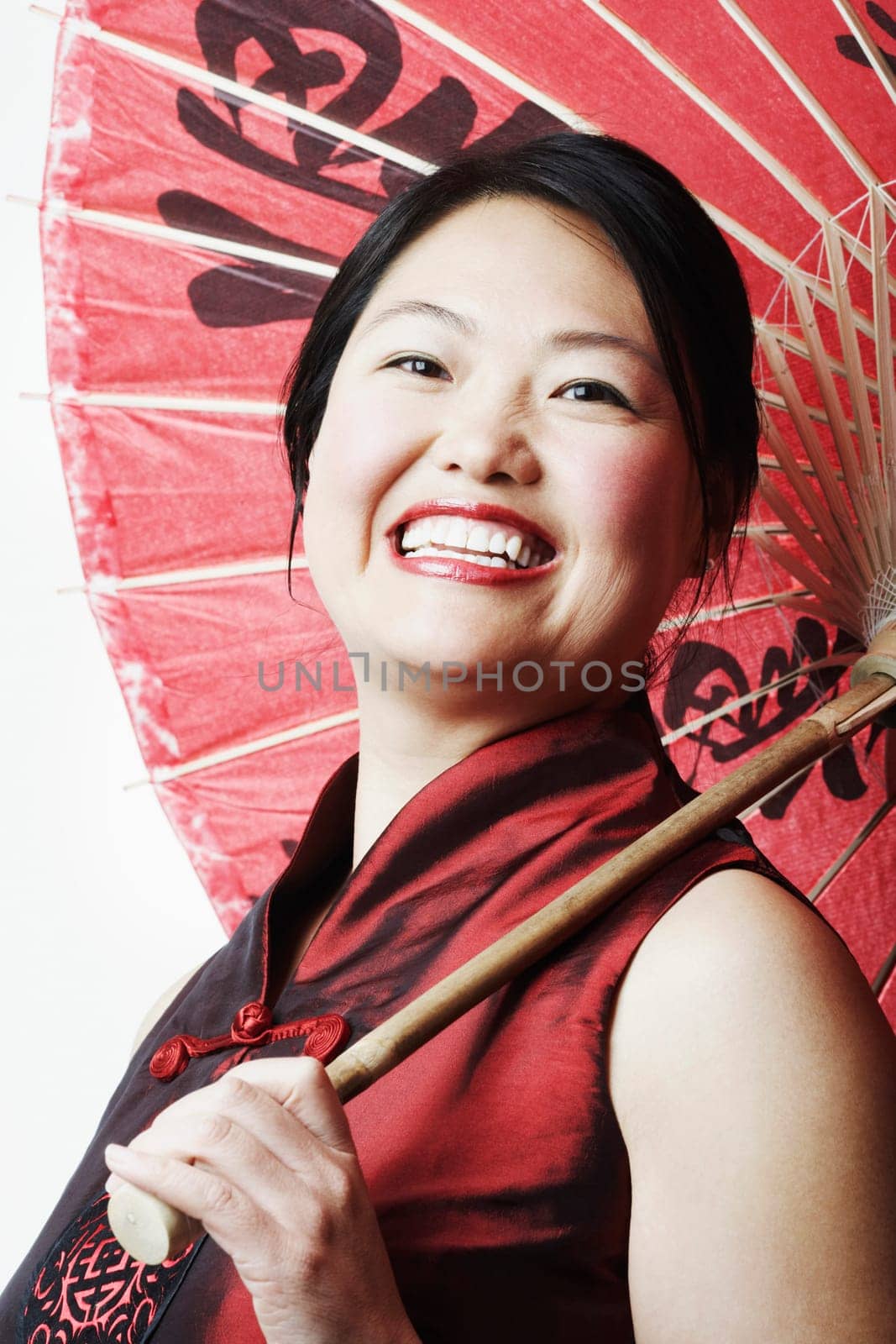 Portrait of a mid adult woman holding a parasol