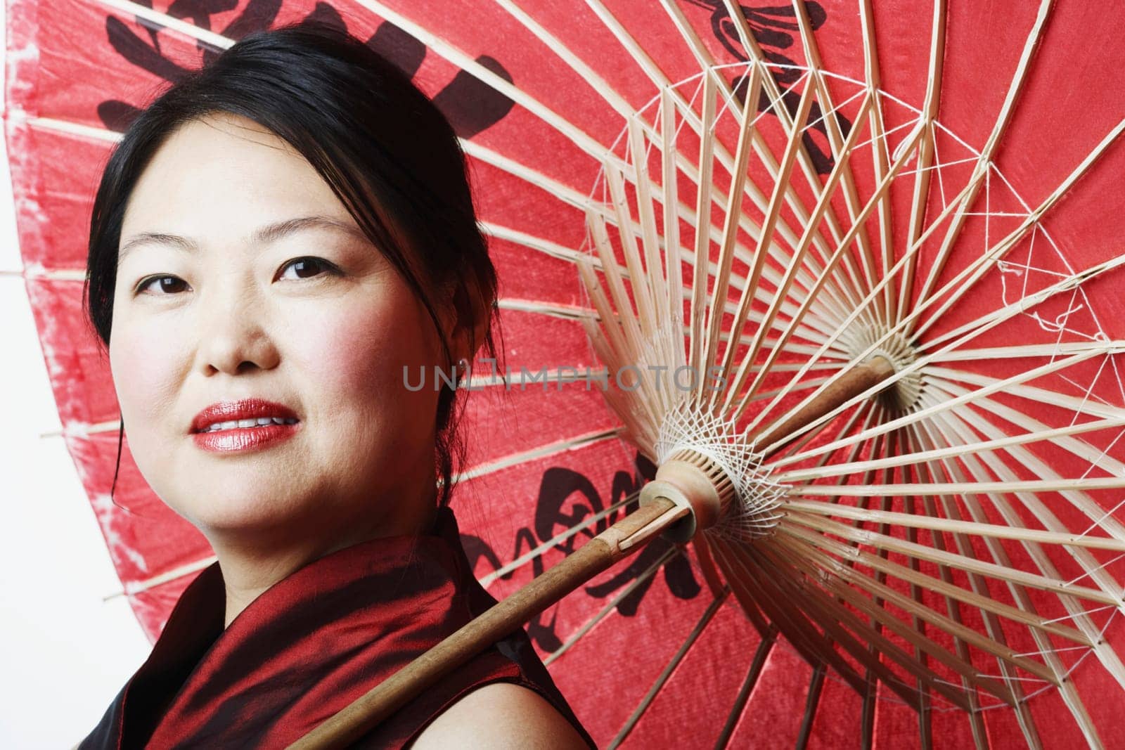 Portrait of a mid adult woman holding a parasol