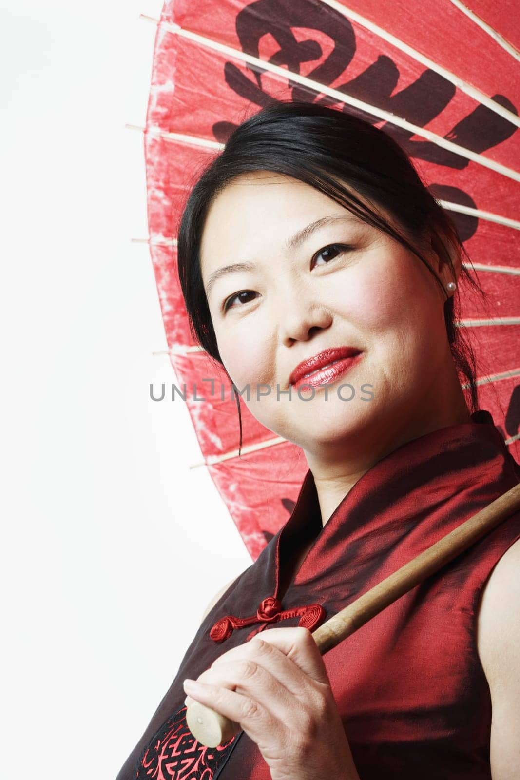 Portrait of a mid adult woman holding a parasol