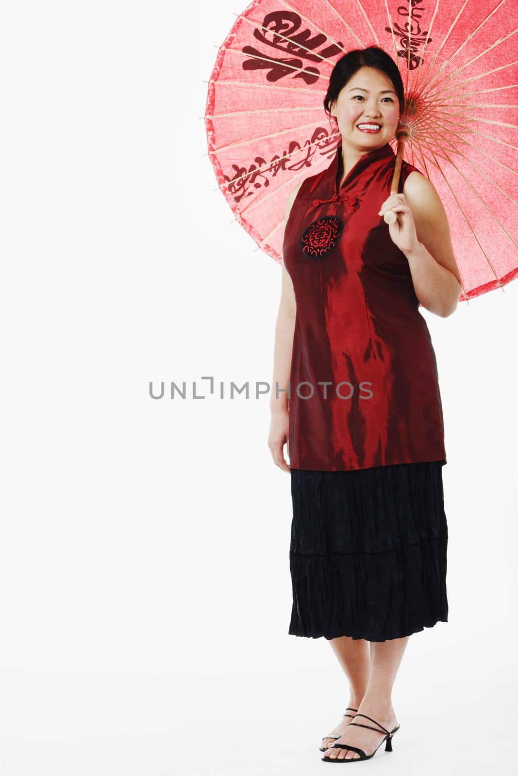 Mid adult woman holding a parasol