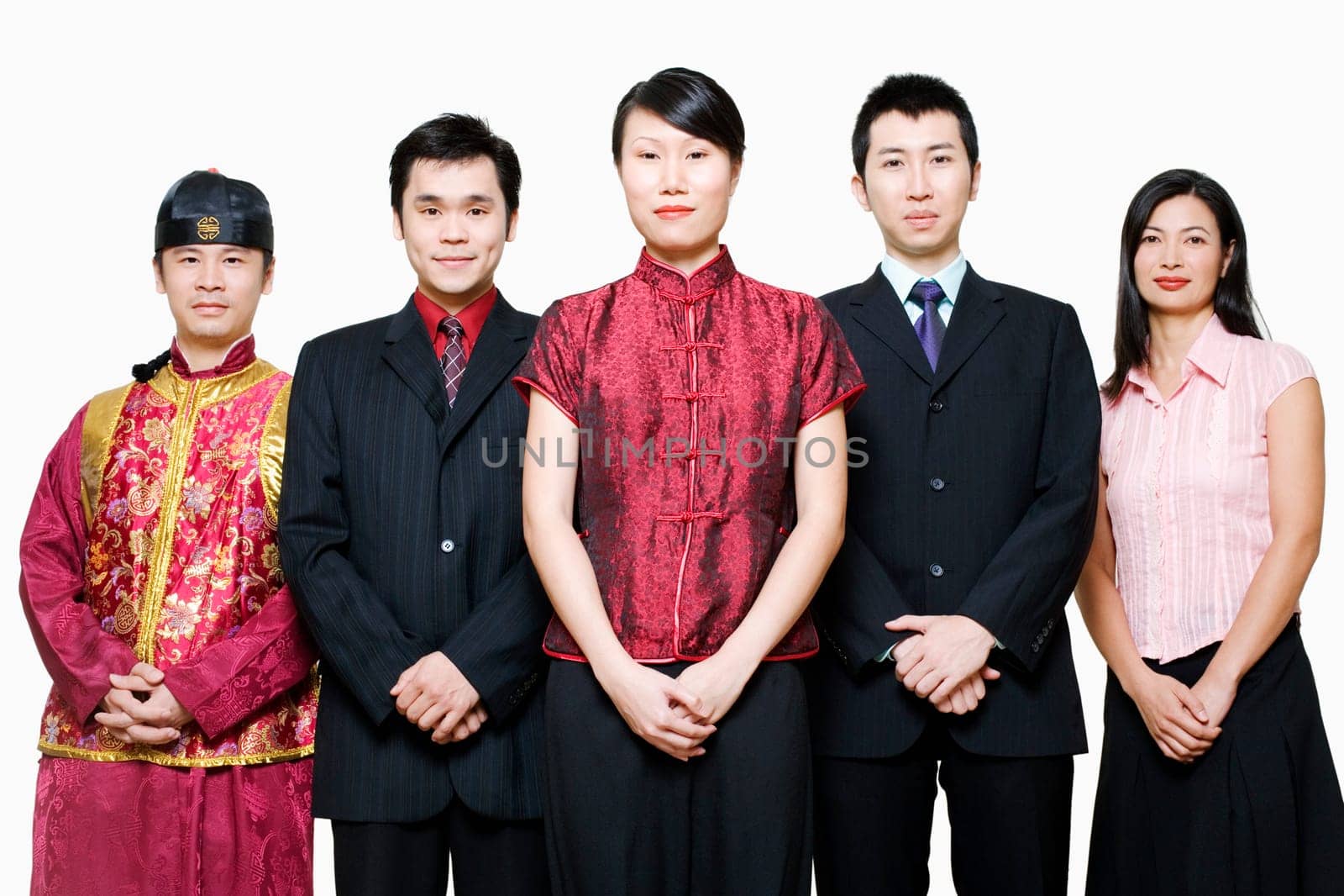 Portrait of four business executives and a young man standing together