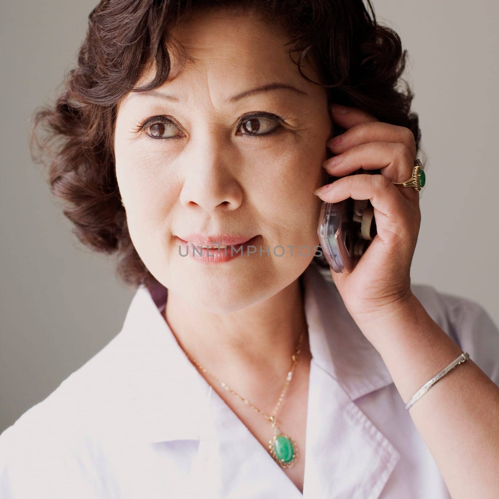 Close-up of a female doctor talking on a mobile phone
