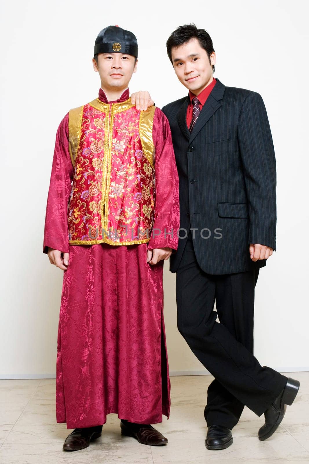 Portrait of a businessman and a young man standing together