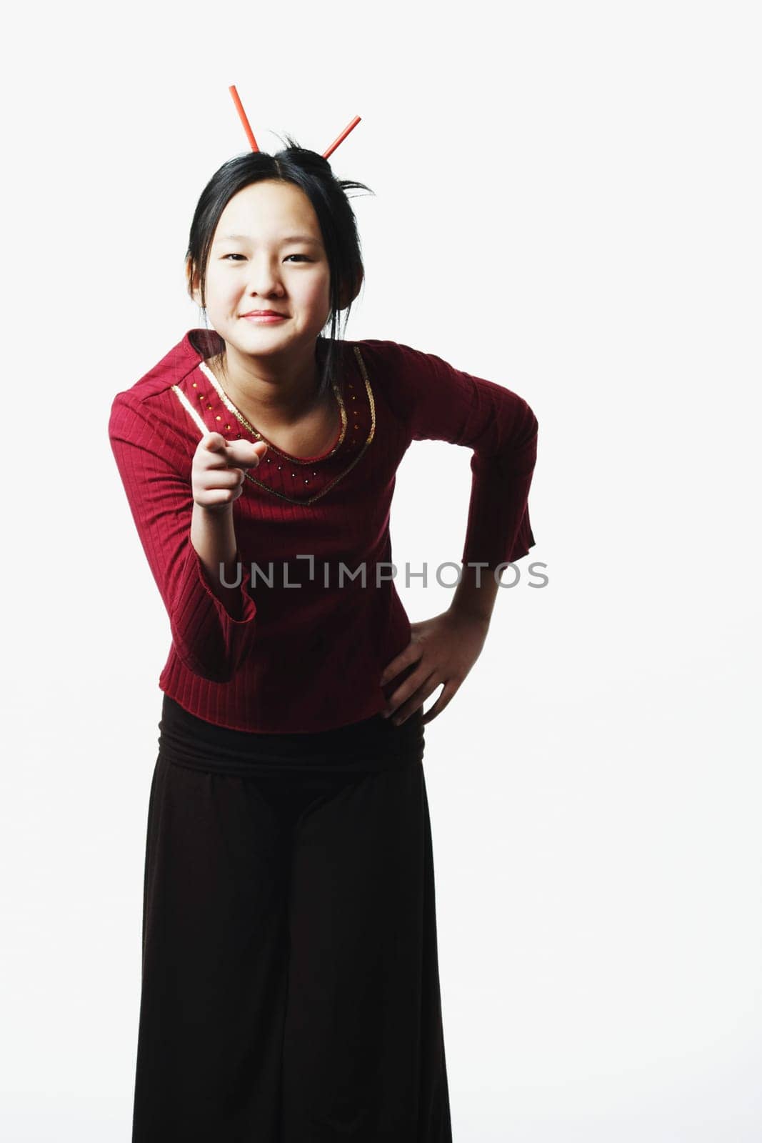 Portrait of a teenage girl pointing