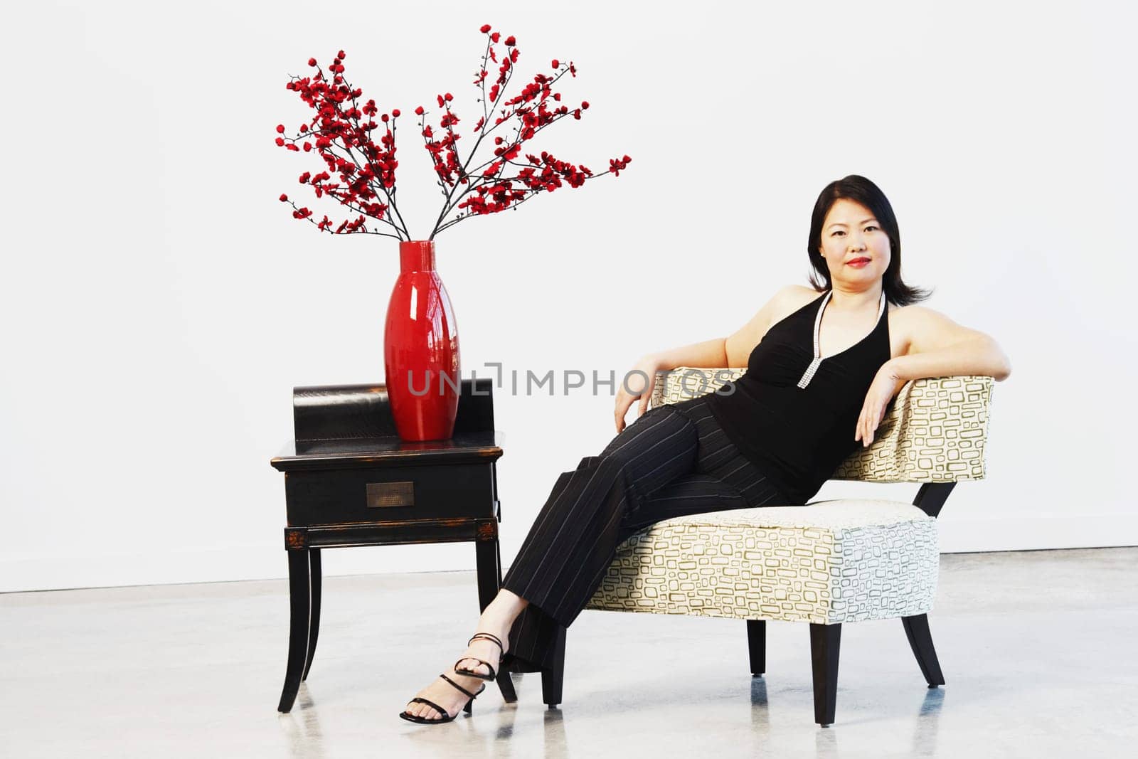 Portrait of a mid adult woman sitting on a chair