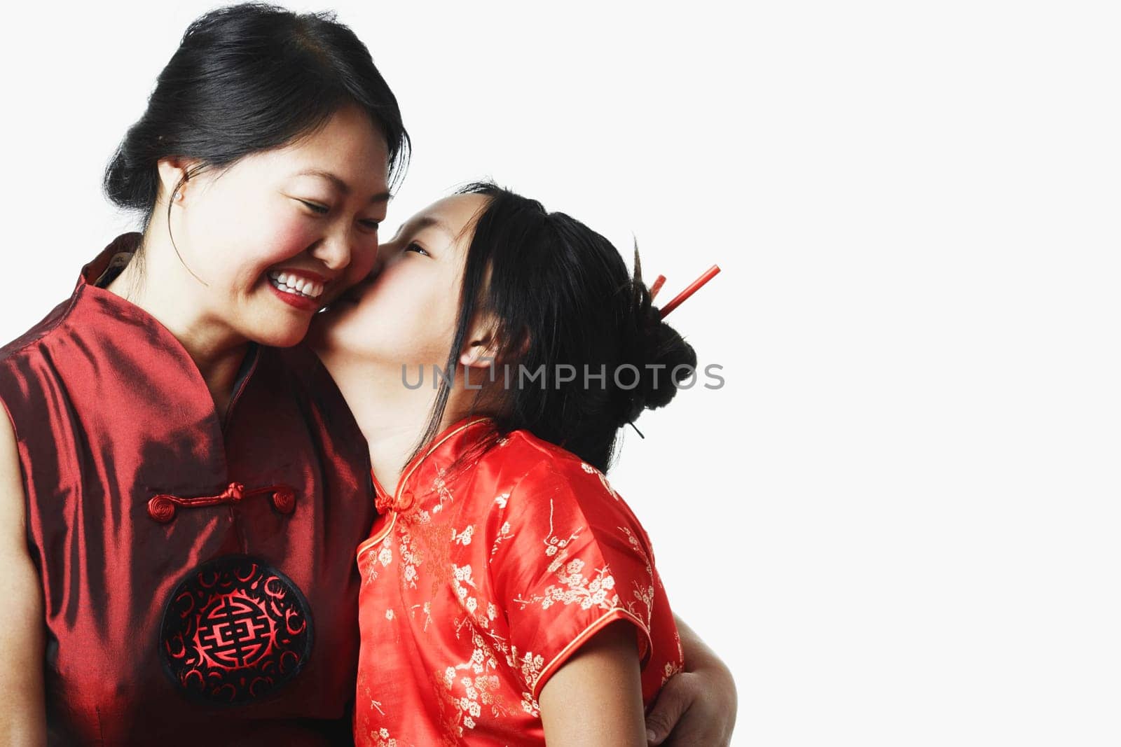Close-up of a daughter kissing her mother