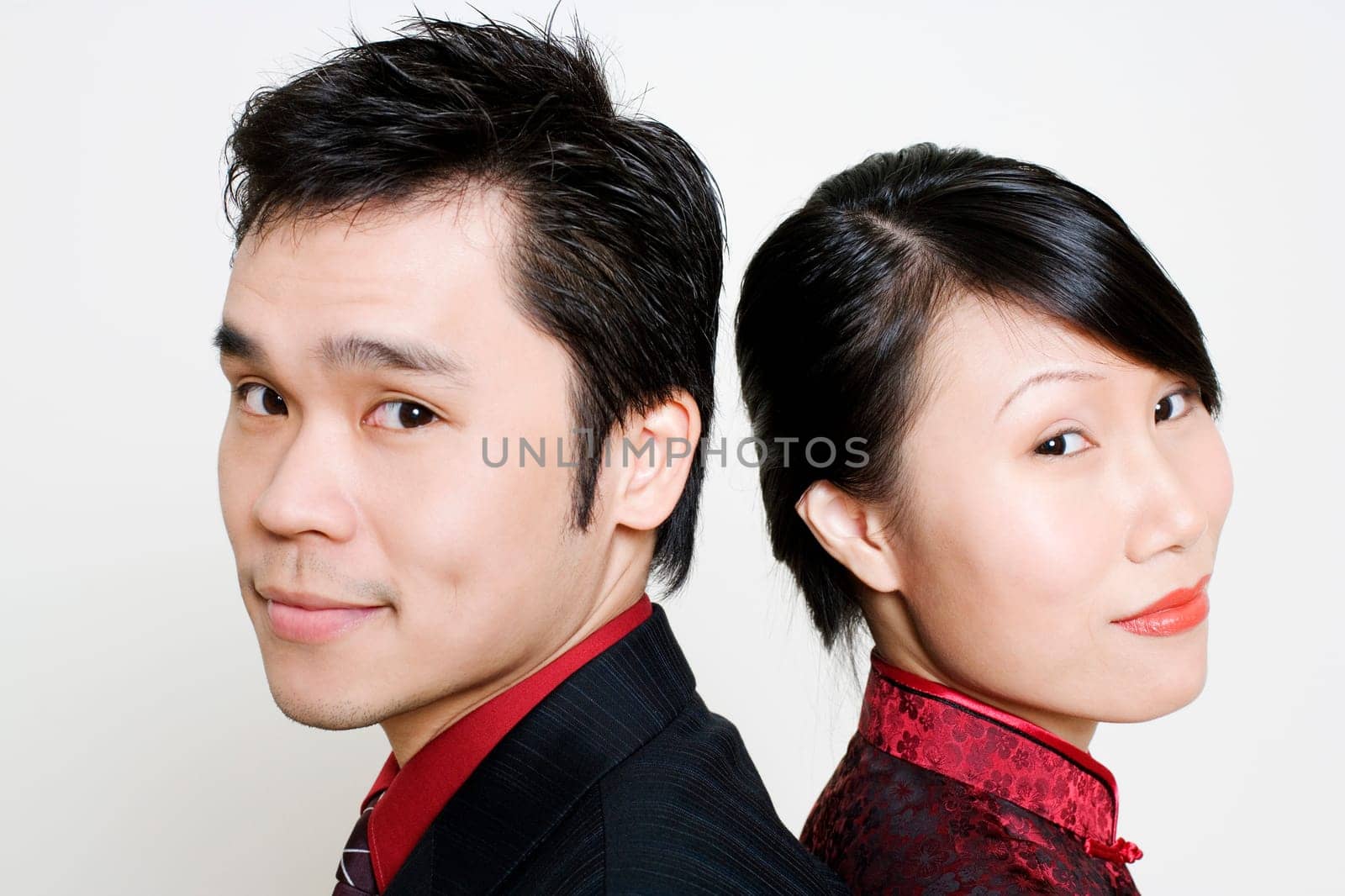 Portrait of a mid adult man and a young woman smiling