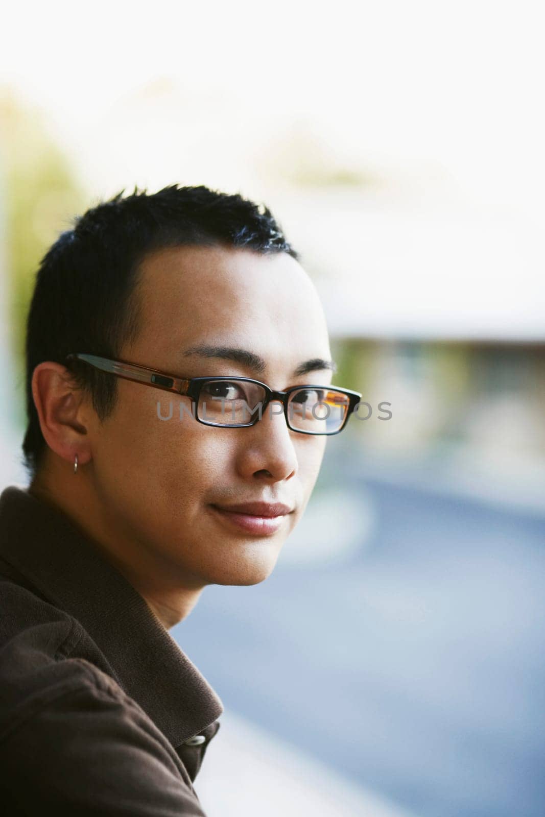 Portrait of a young man grinning