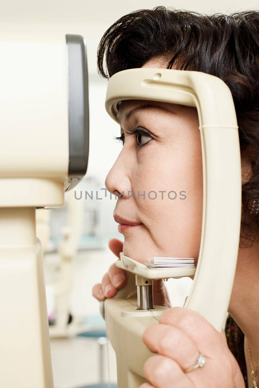 Side profile of a patient being examined with an ophthalmoscope
