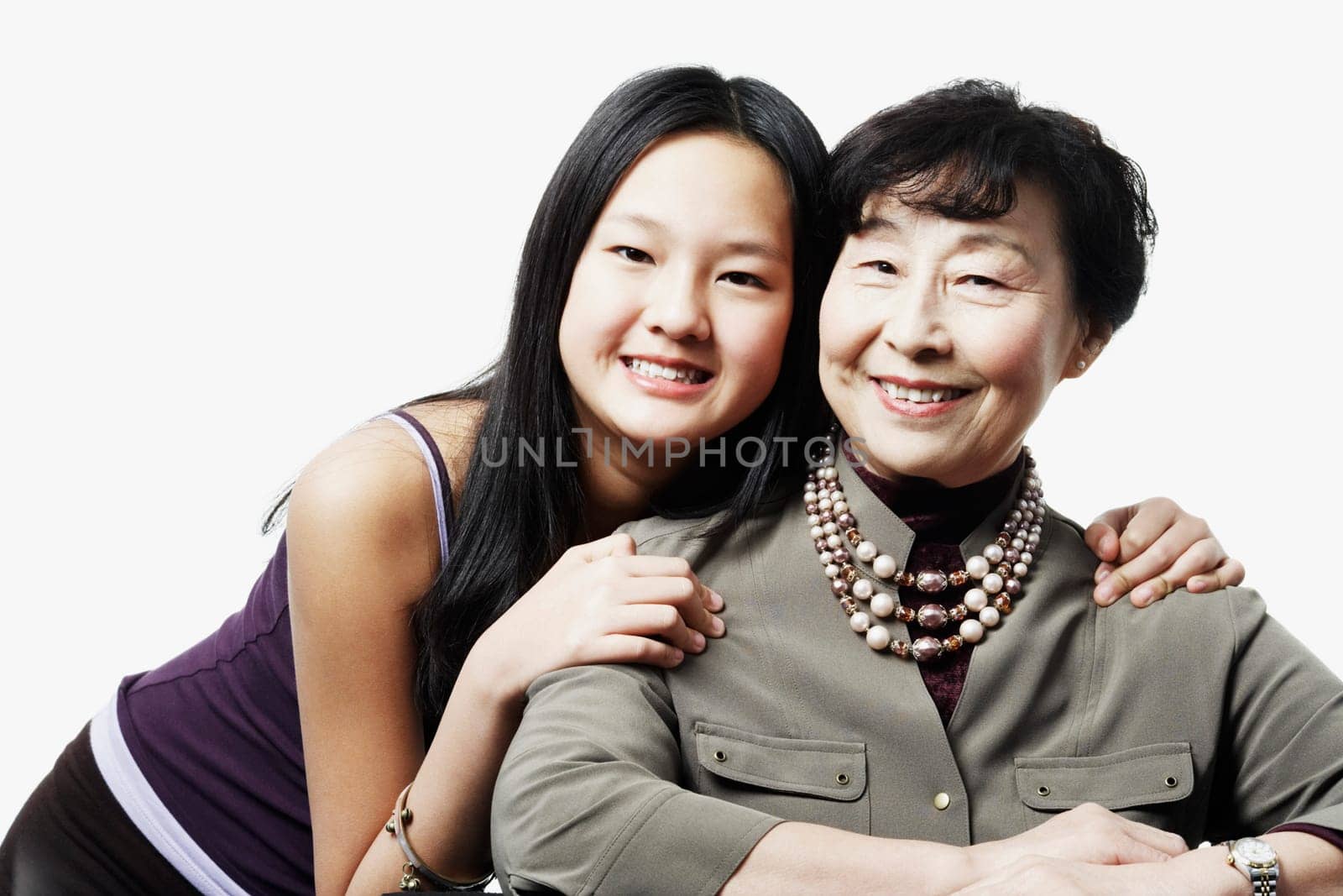 Portrait of a grandmother and her granddaughter smiling