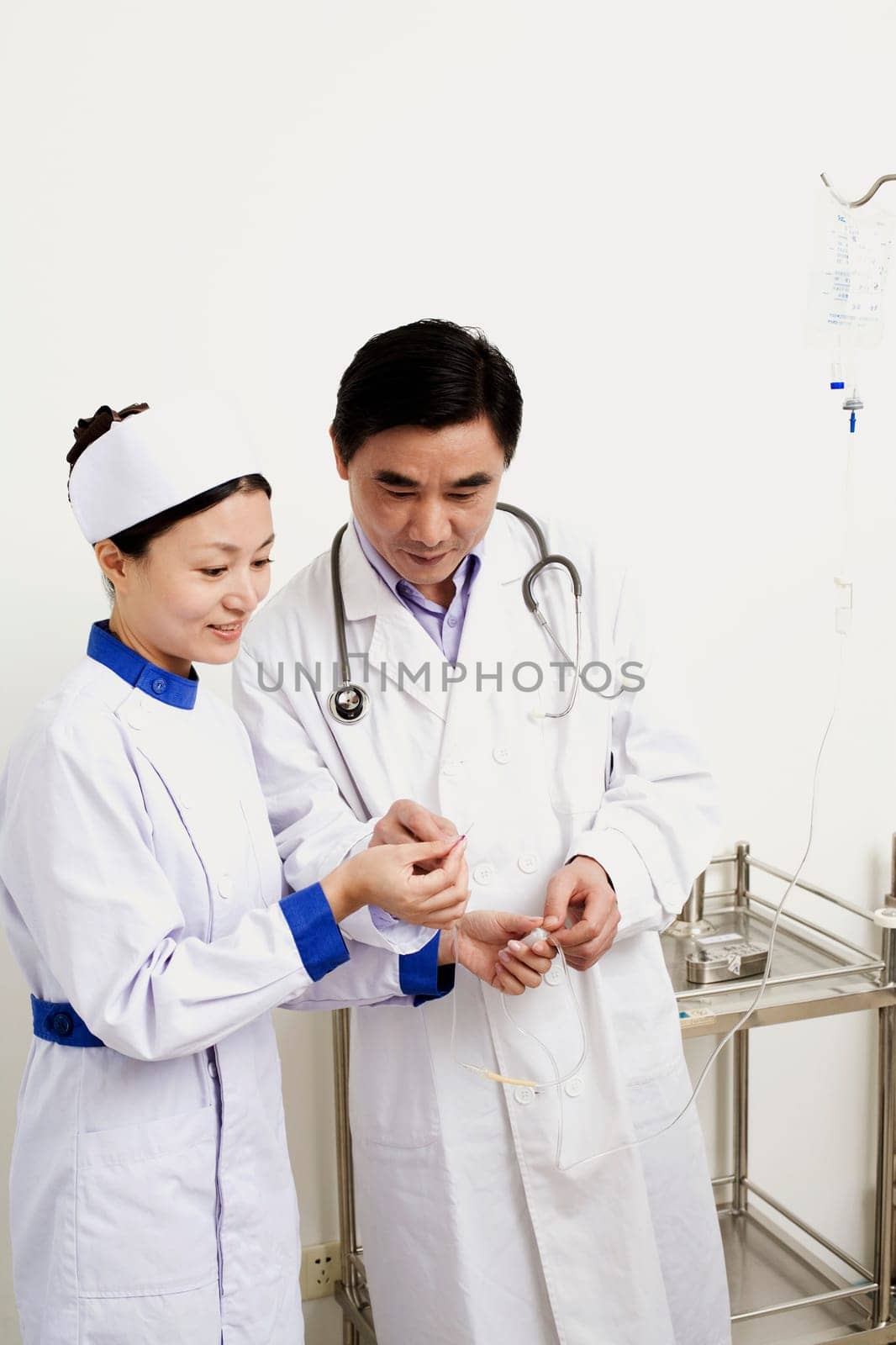 Close-up of a male doctor and female nurse discussing