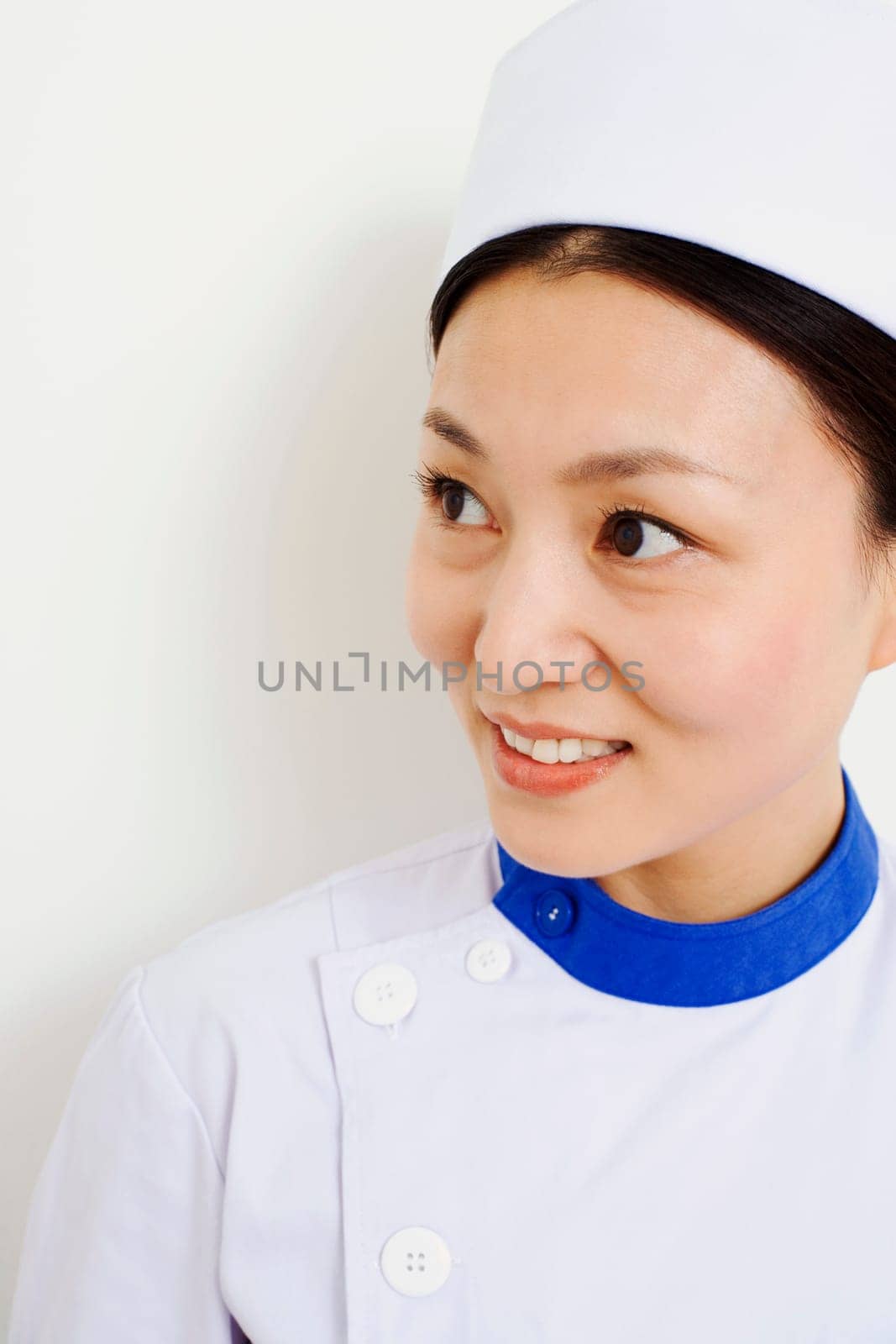 Close-up of a female nurse looking away