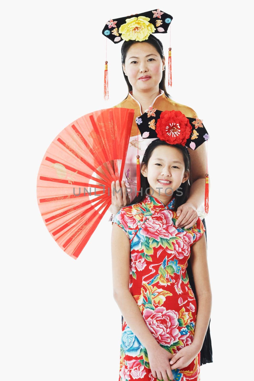 Portrait of a mother standing behind her daughter