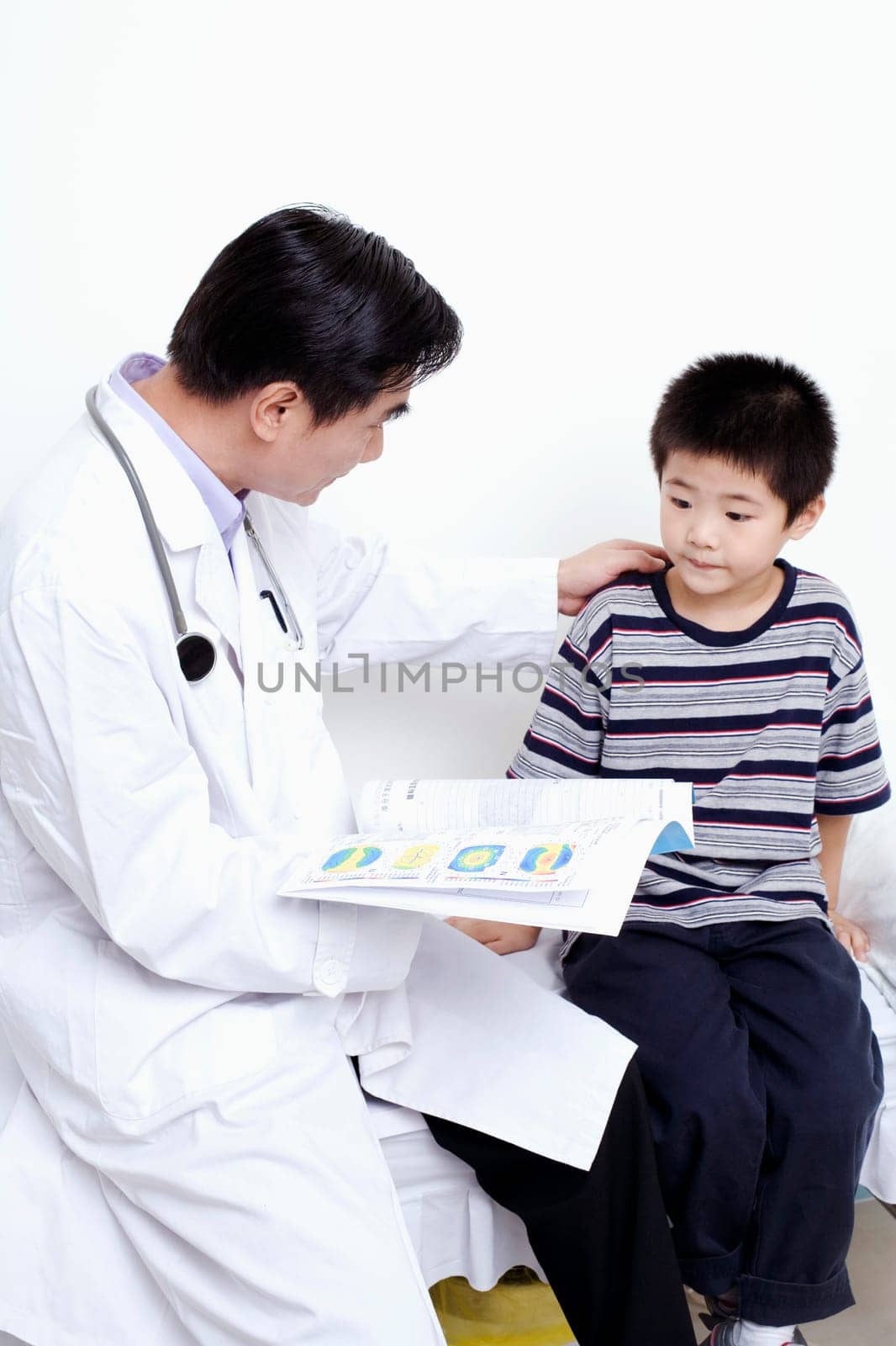 Side profile of a doctor holding the report of a child
