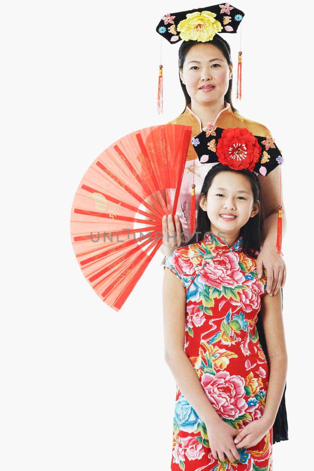 Portrait of a mother standing behind her daughter