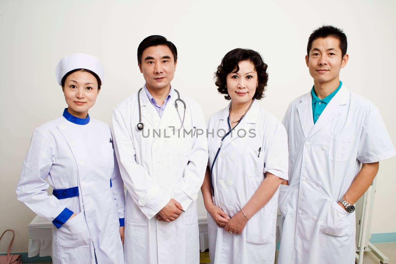 Portrait of three doctors and a nurse