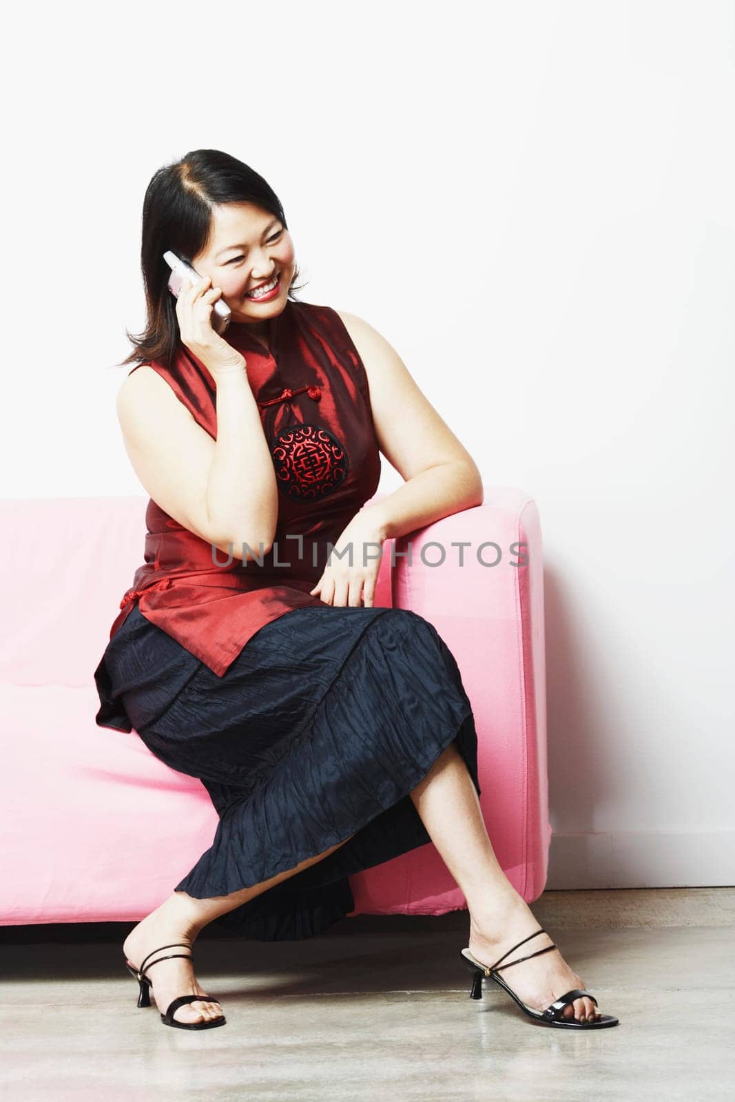 Mid adult woman talking on a mobile phone