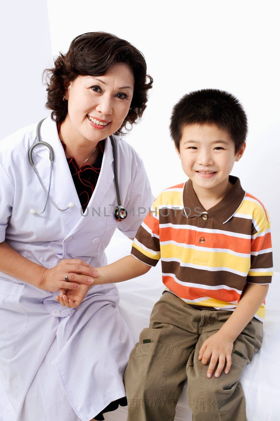 Portrait of a female doctor taking a patientŽs pulse