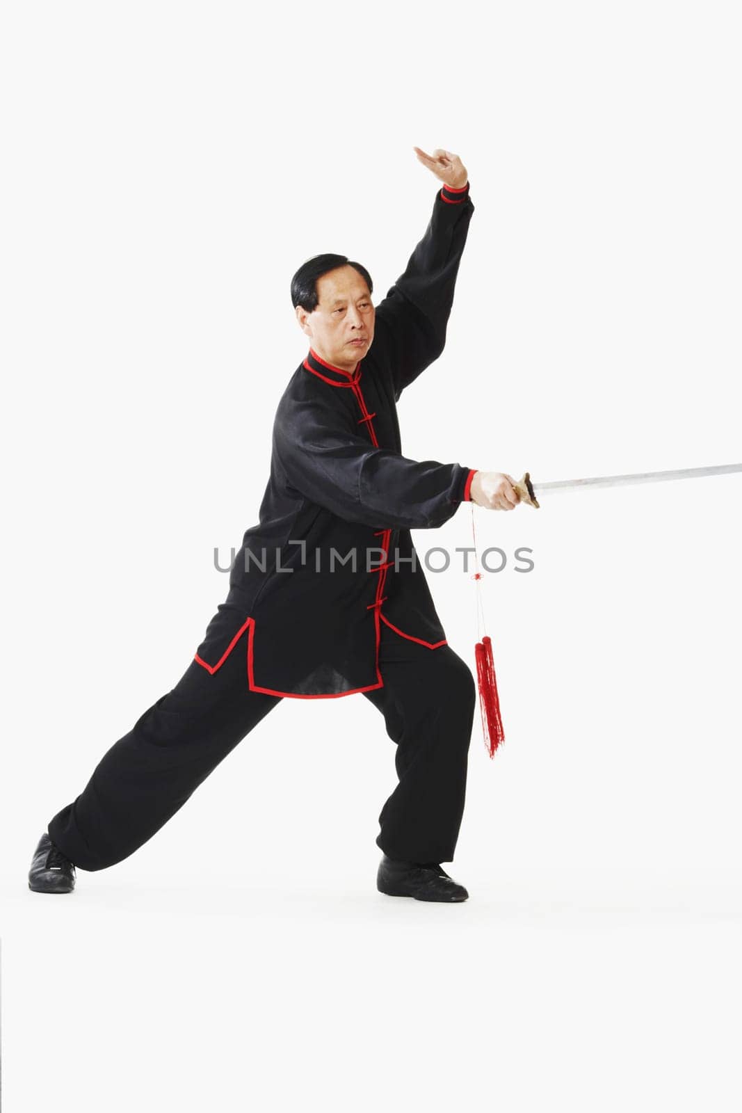 Portrait of a mature man holding a sword
