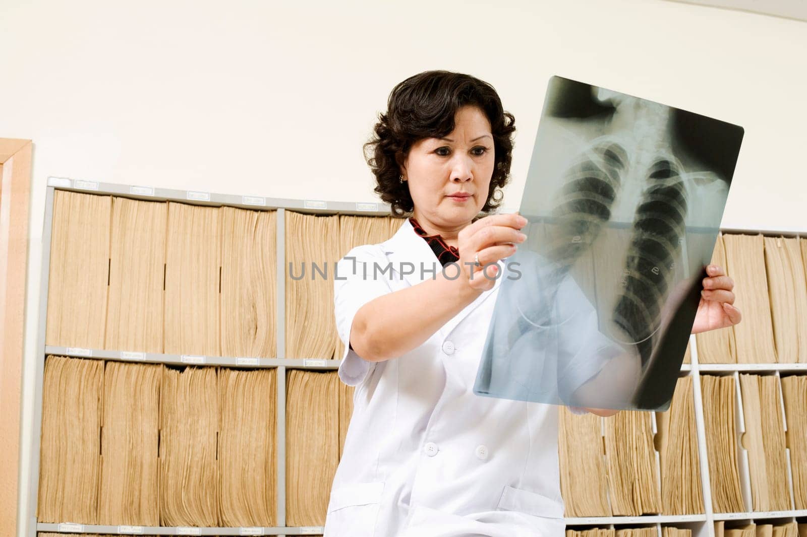 Close-up of a female doctor looking at X-Ray image