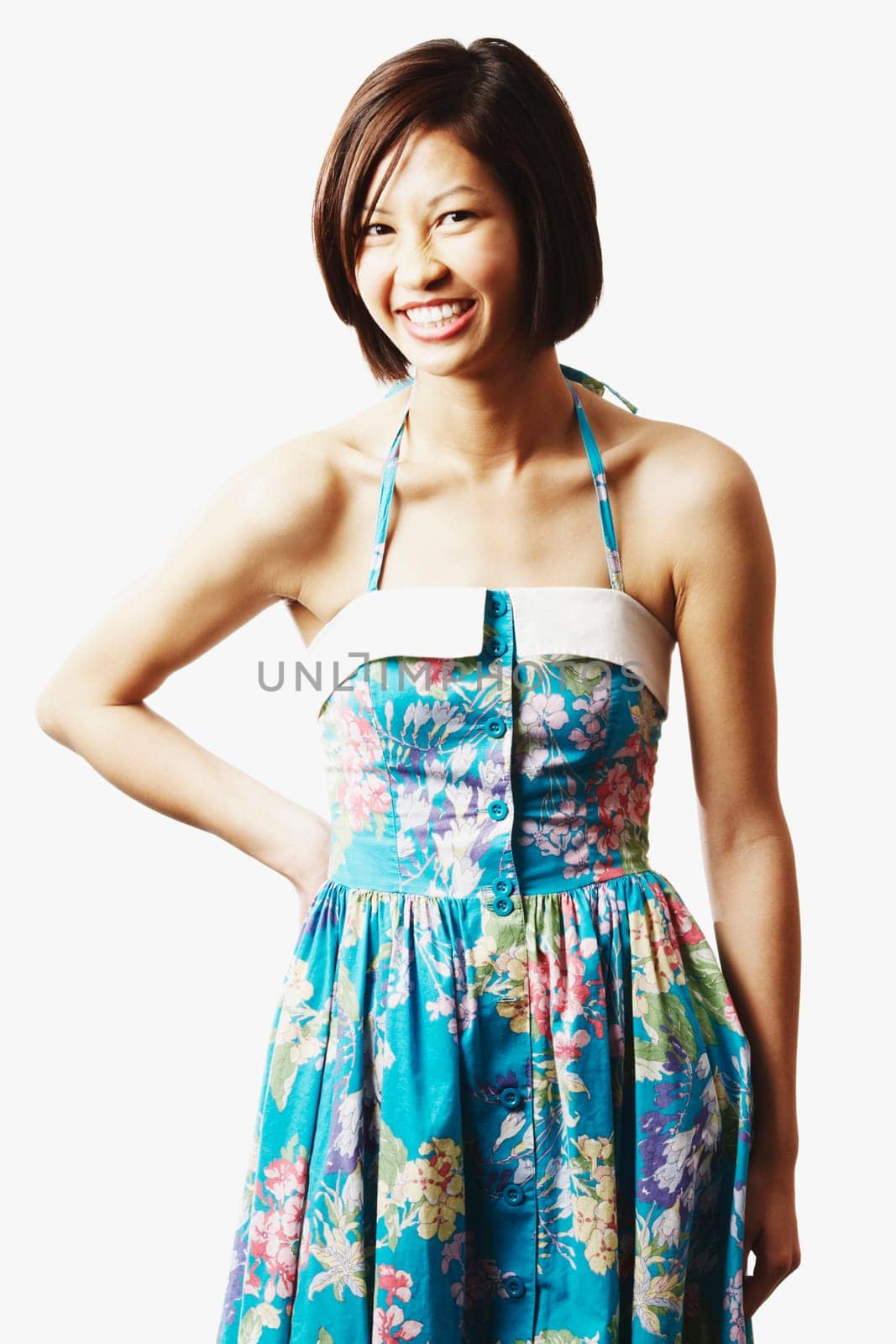 Portrait of a young woman standing with her hand on her hip