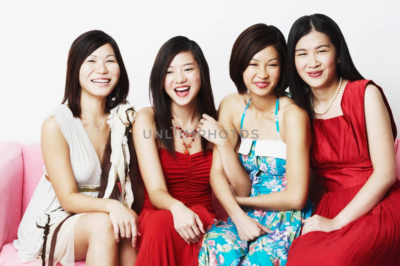 Portrait of four young women sitting together