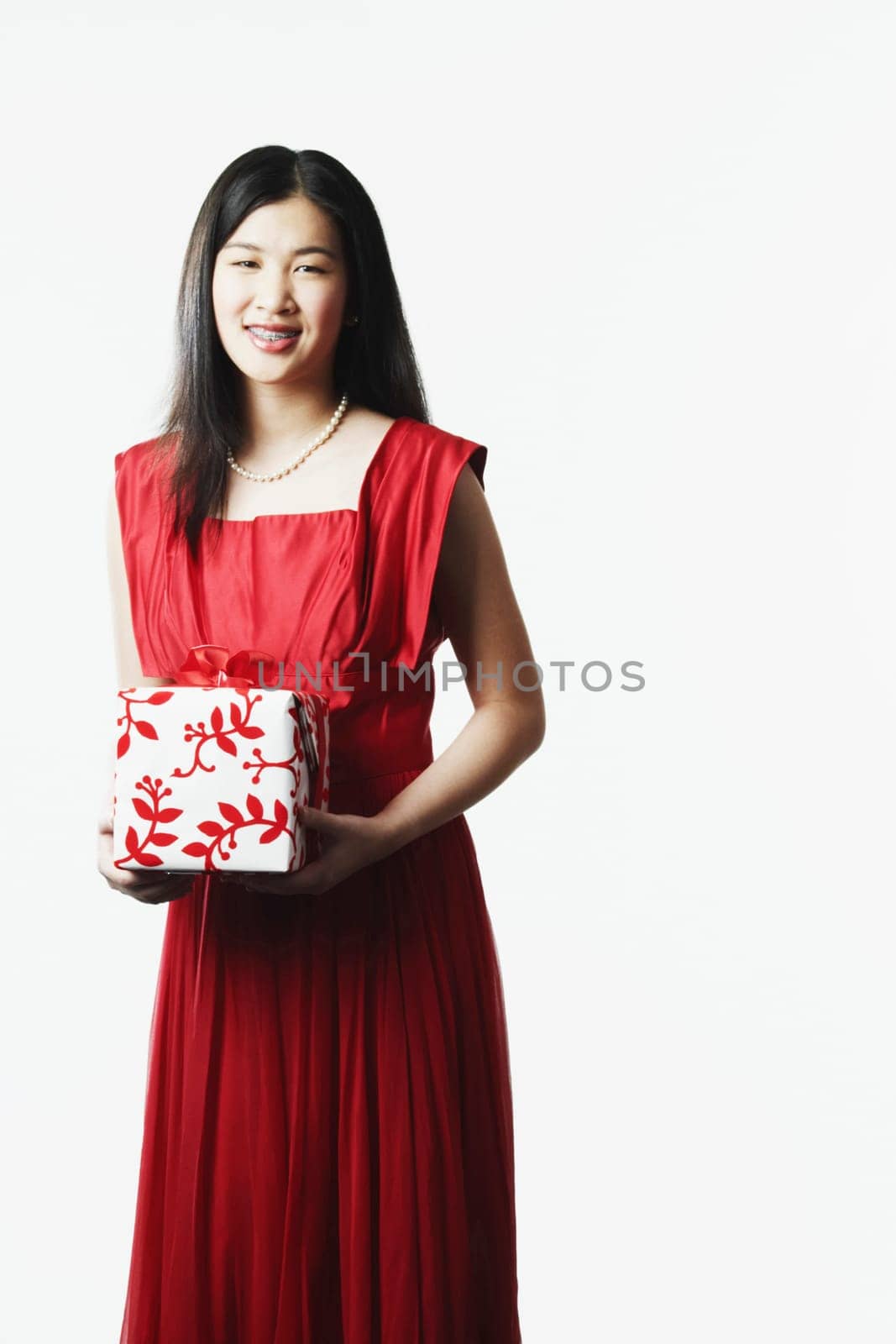 Portrait of a young woman holding a gift