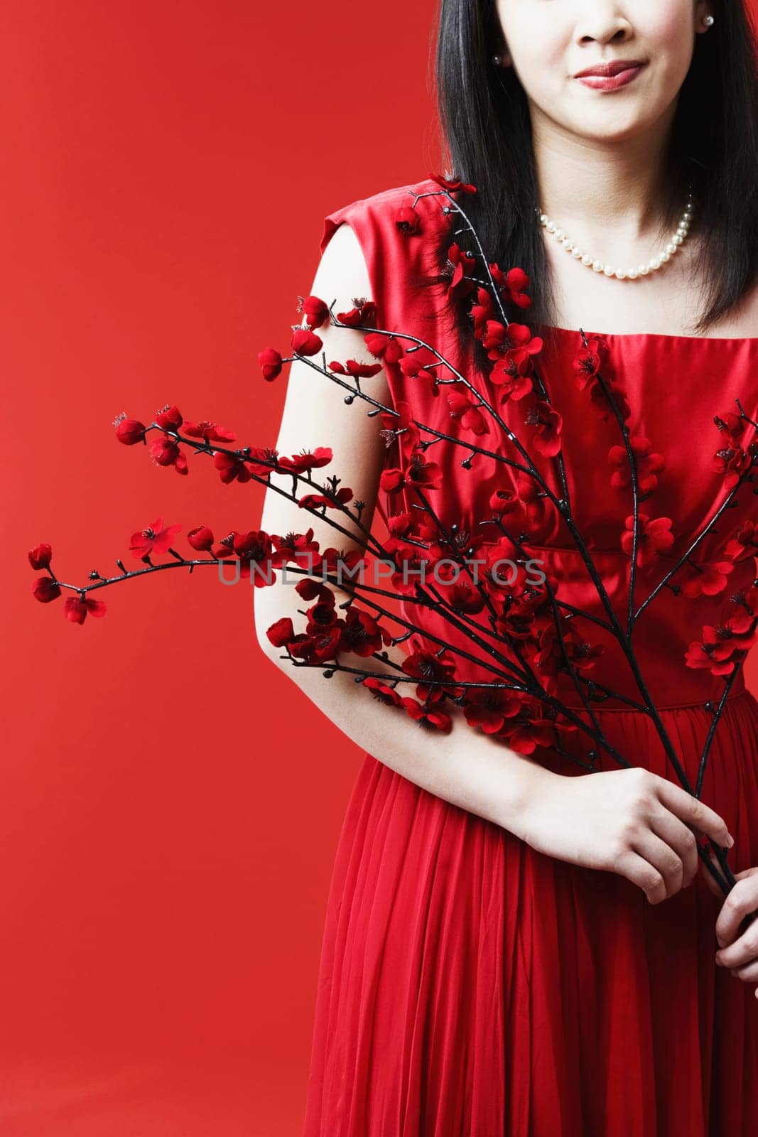 Portrait of a young woman holding flowers