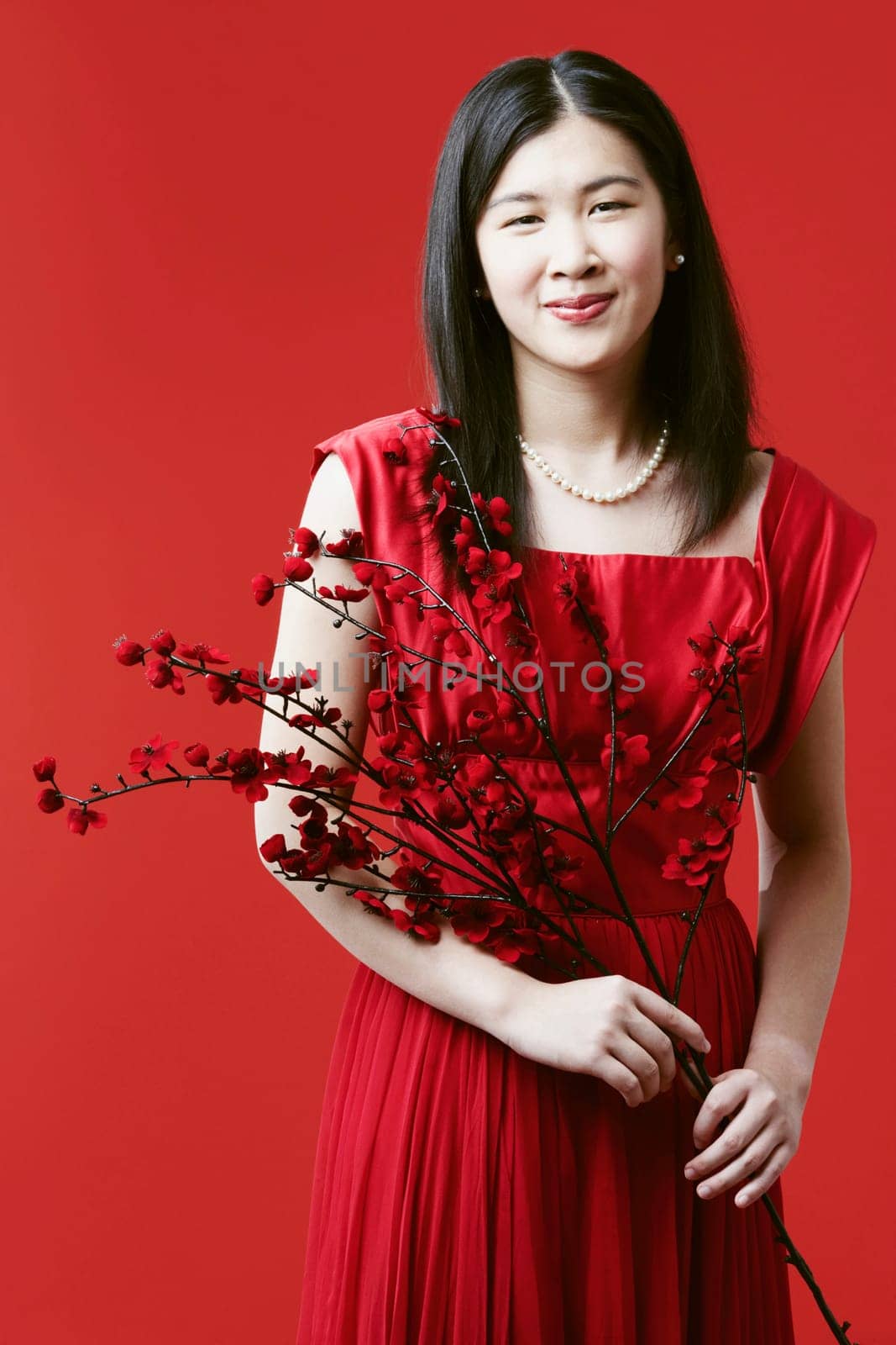 Portrait of a young woman holding flowers