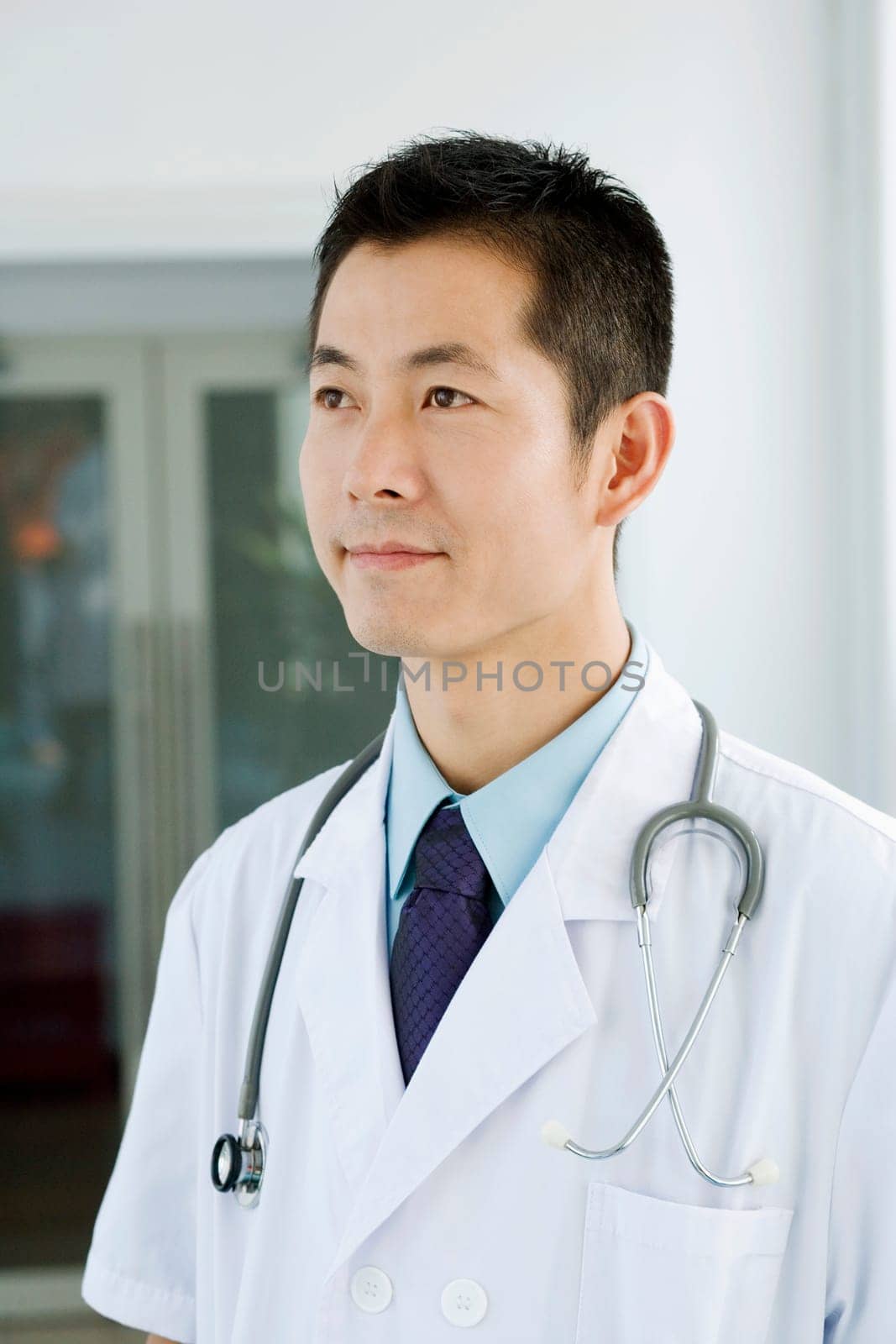 Close-up of a male doctor looking away