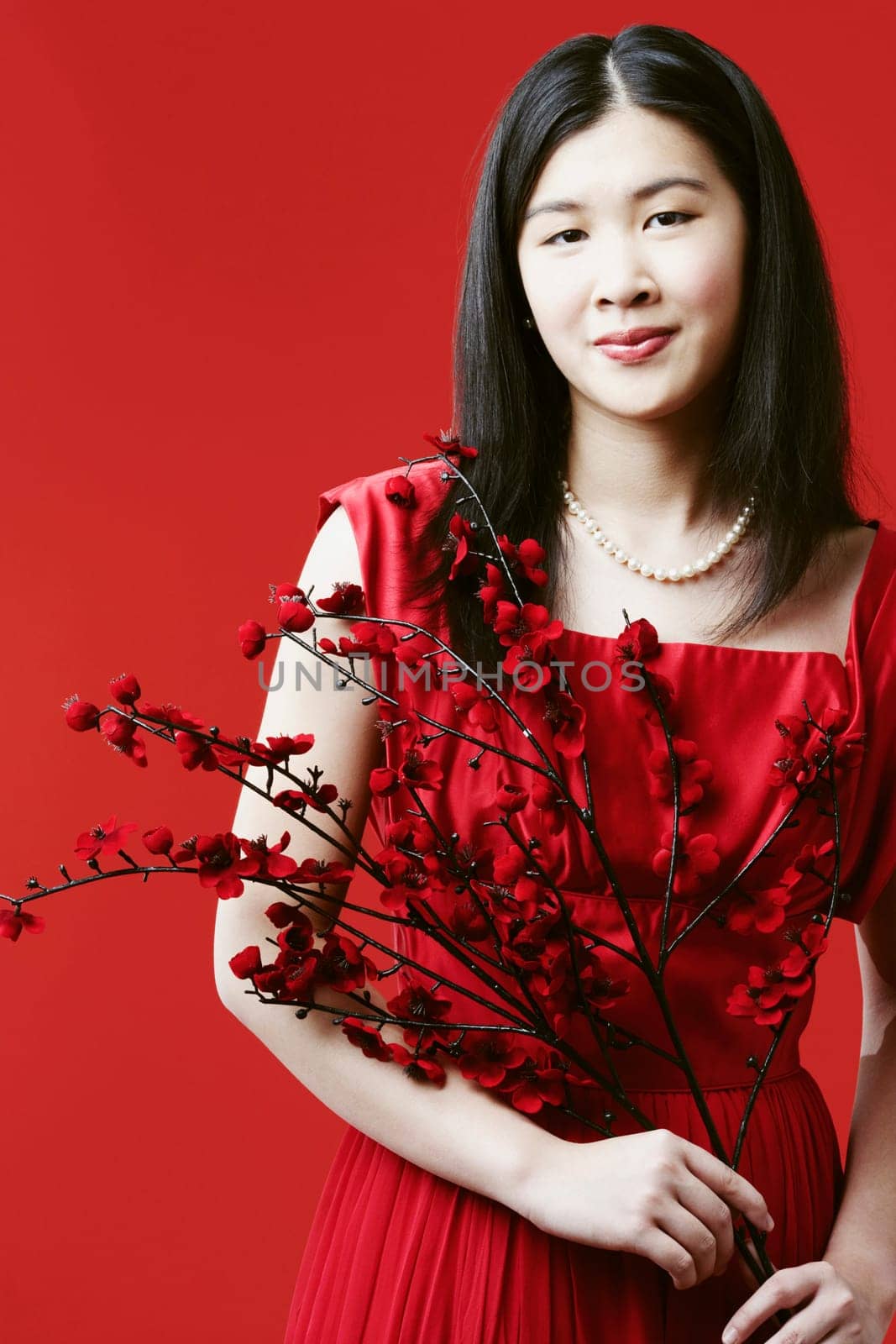 Portrait of a young woman holding flowers