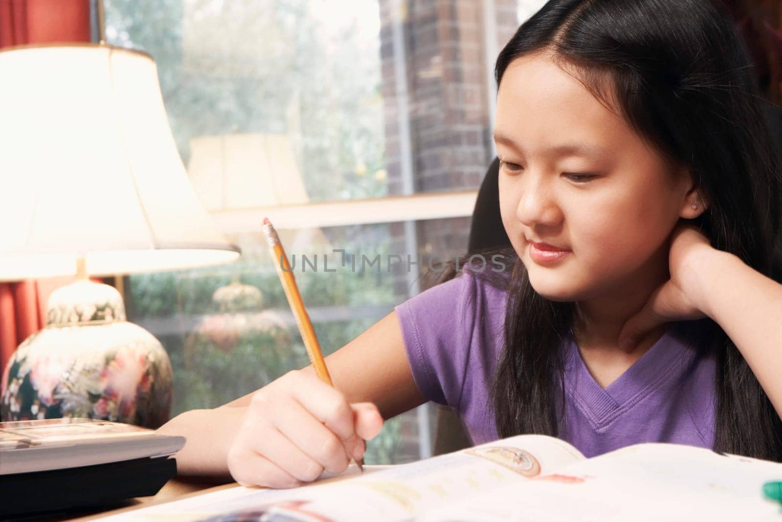 Close-up of a girl writing
