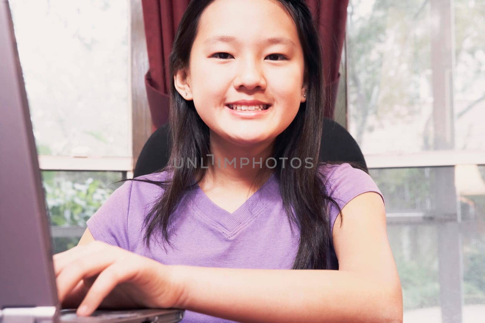 Portrait of a girl using a laptop