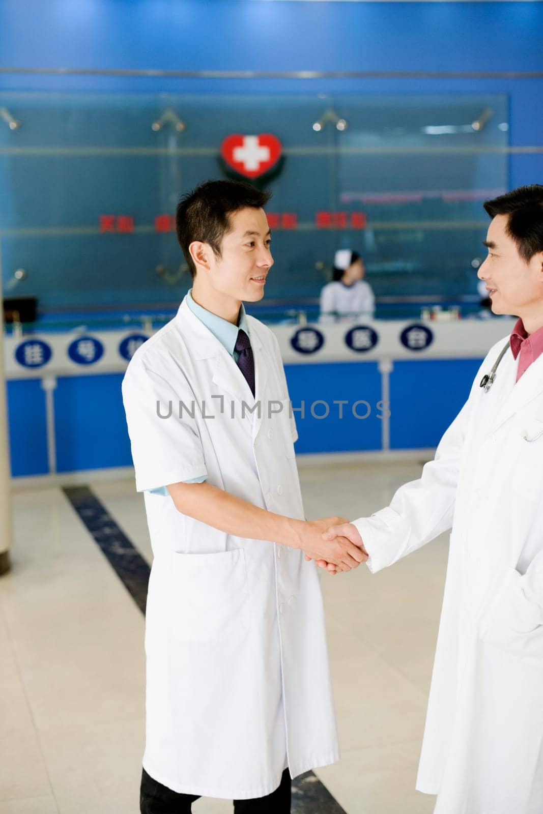 Close-up of two male doctors shaking hands