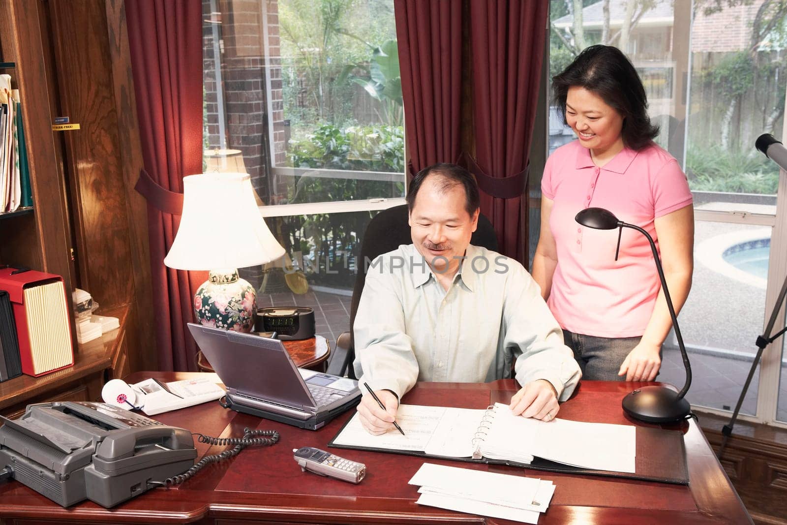 High angle view of a senior man talking to a mature woman